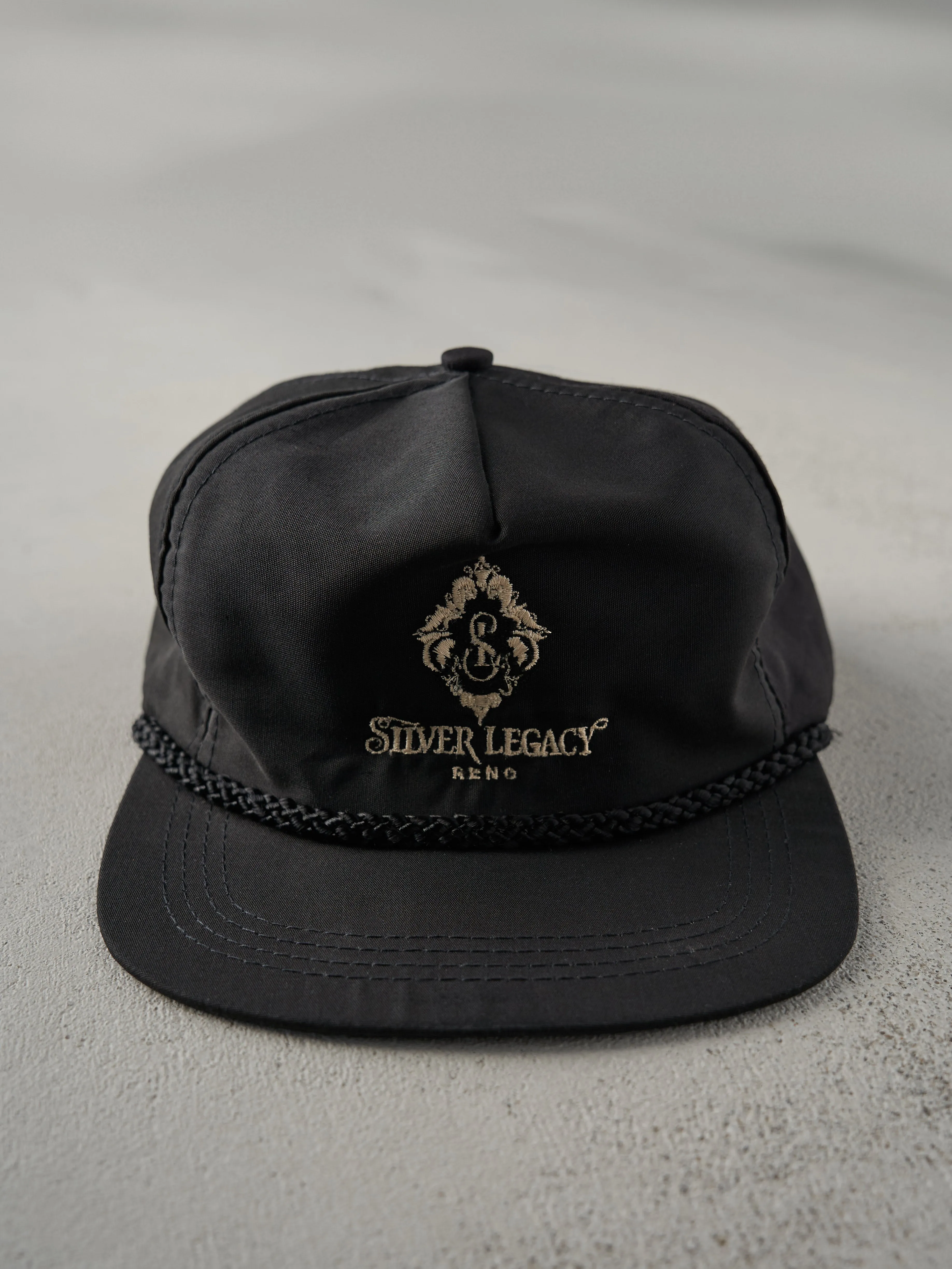 Vintage 80s Black Silver Legacy Reno Leather Strap Back Hat sold by Rebalance Vintage