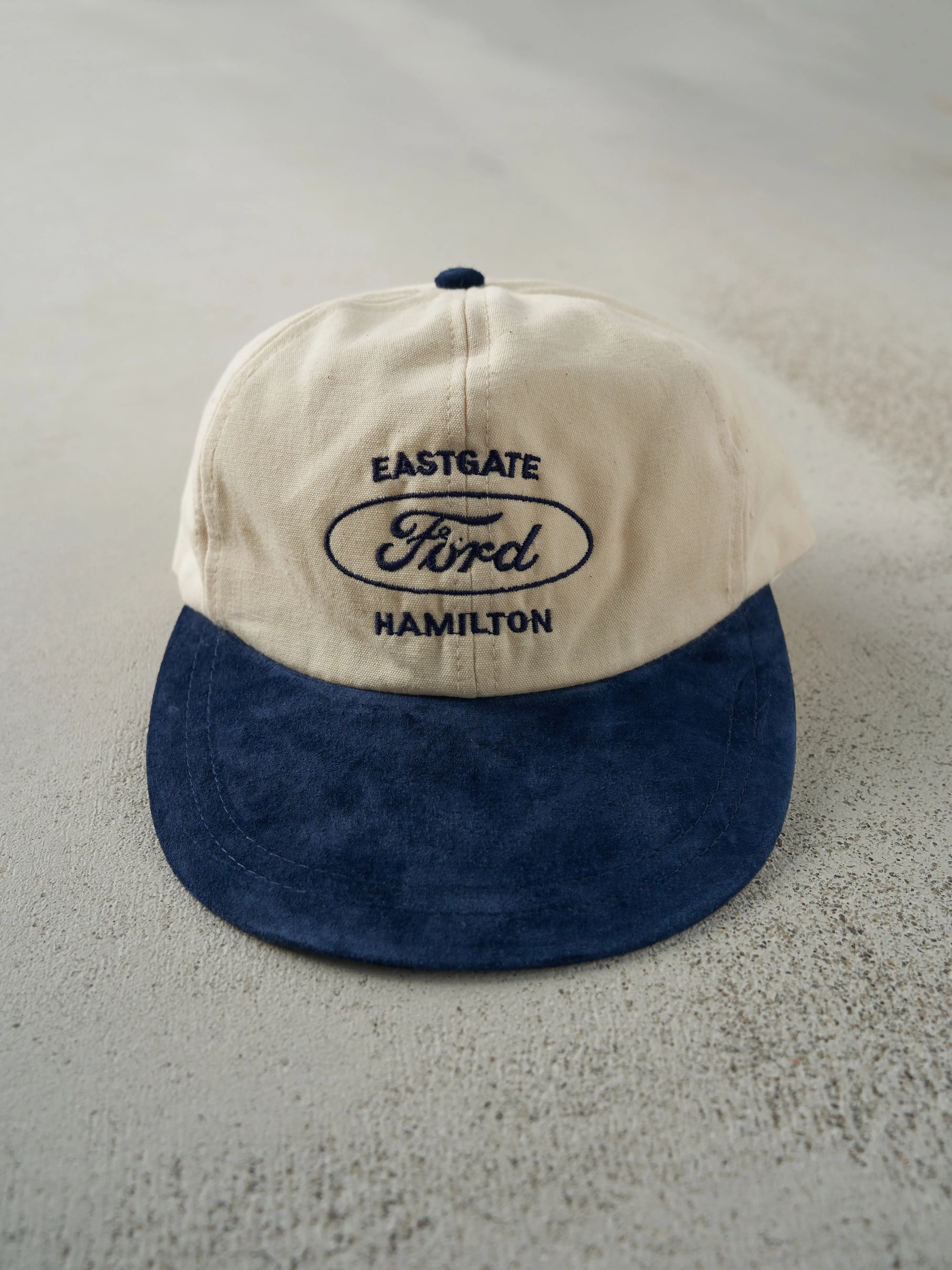 Vintage 80s Beige & Navy Eastgate Hamilton Ford Suede Leather Strap Back Hat sold by Rebalance Vintage