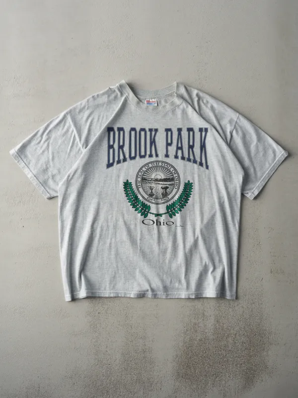 Vintage 97' Heather Grey Brook Park Ohio Tee (L) sold by Rebalance Vintage