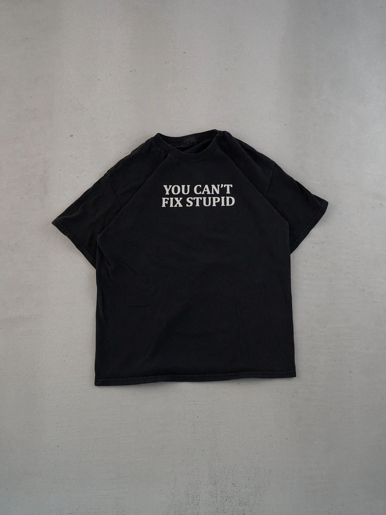 Vintage 90s Washed Black You Can't Fix Stupid Tee (M) sold by Rebalance Vintage