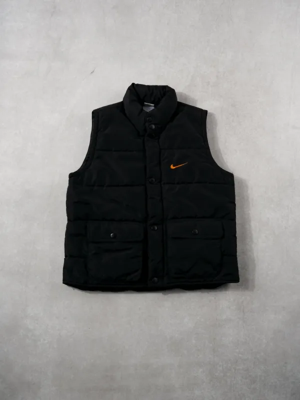 Vintage 90s Black + Orange Nike Puffer Vest (M) sold by Rebalance Vintage