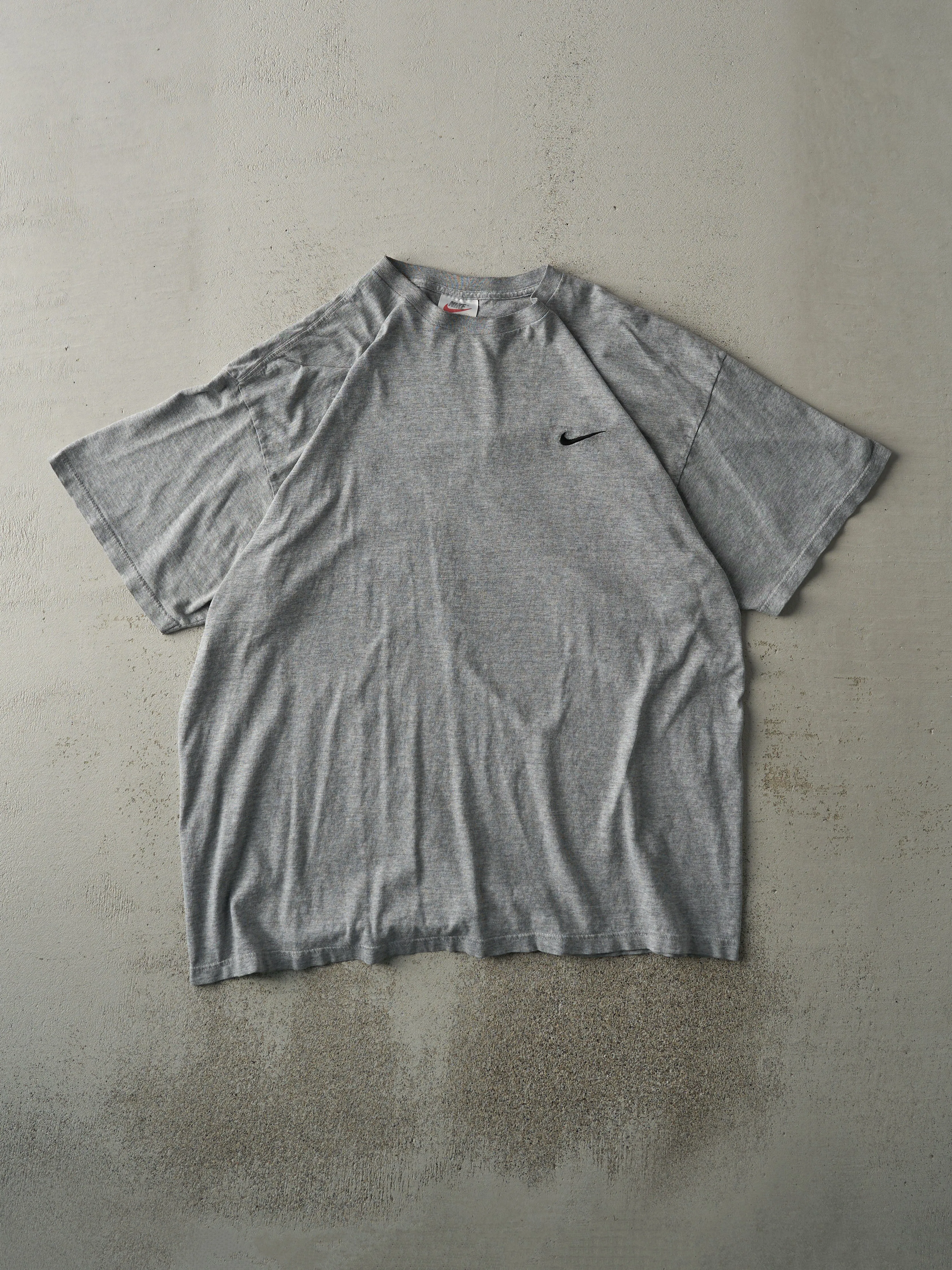 Vintage 90s Grey Embroidered Nike Swoosh Tee (L) sold by Rebalance Vintage