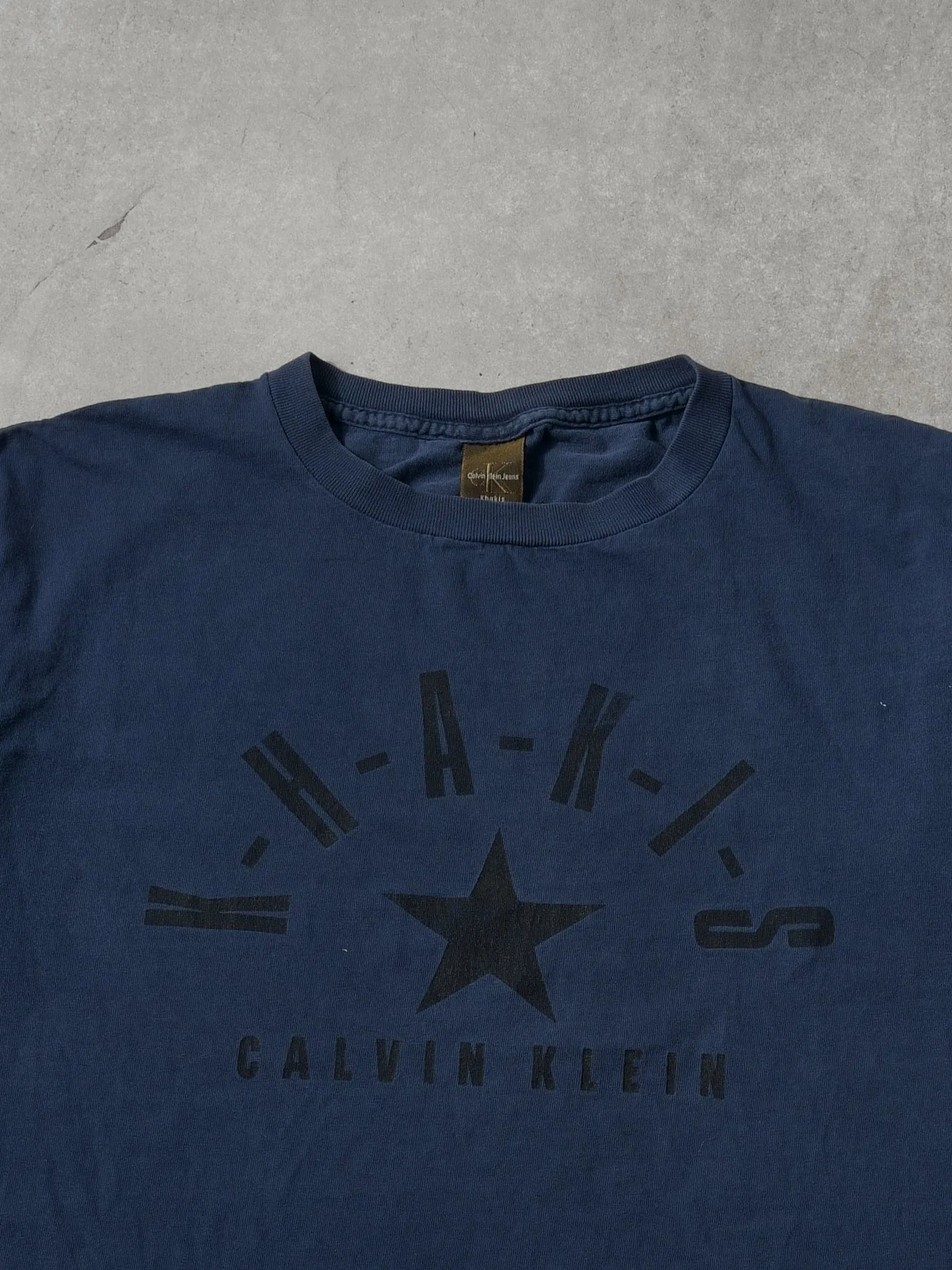 Vintage 90s Navy Blue Calvin Klein Khakis Jeans Graphic Tee (M) sold by Rebalance Vintage product image thumbnail 2