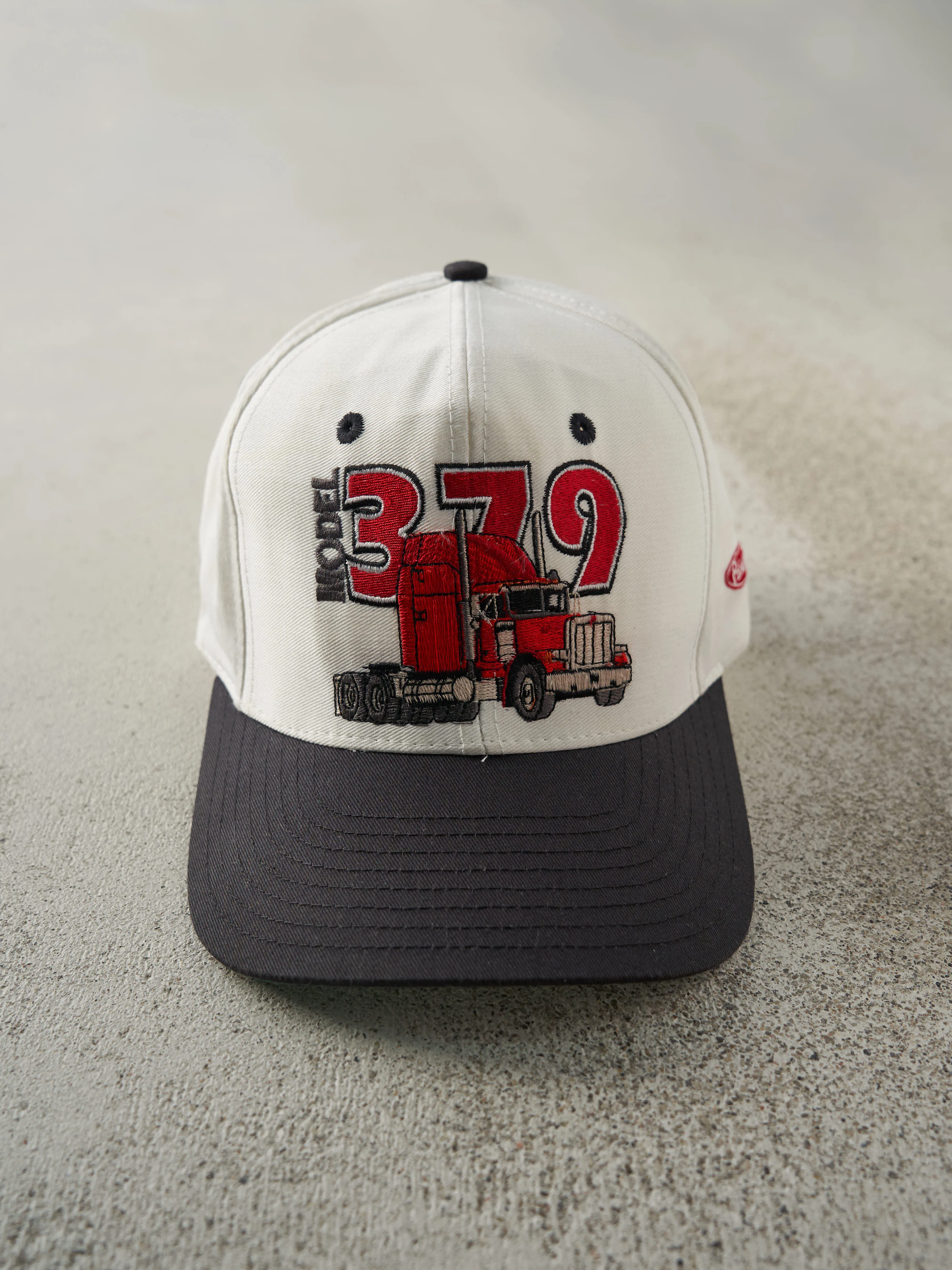 Vintage 90s White, Black & Red Embroidered Model 379 Double Snap Snapback sold by Rebalance Vintage