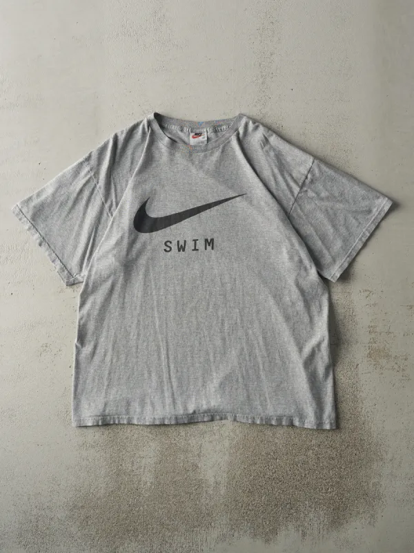 Vintage 90s Grey Nike Swim Tee (L) sold by Rebalance Vintage