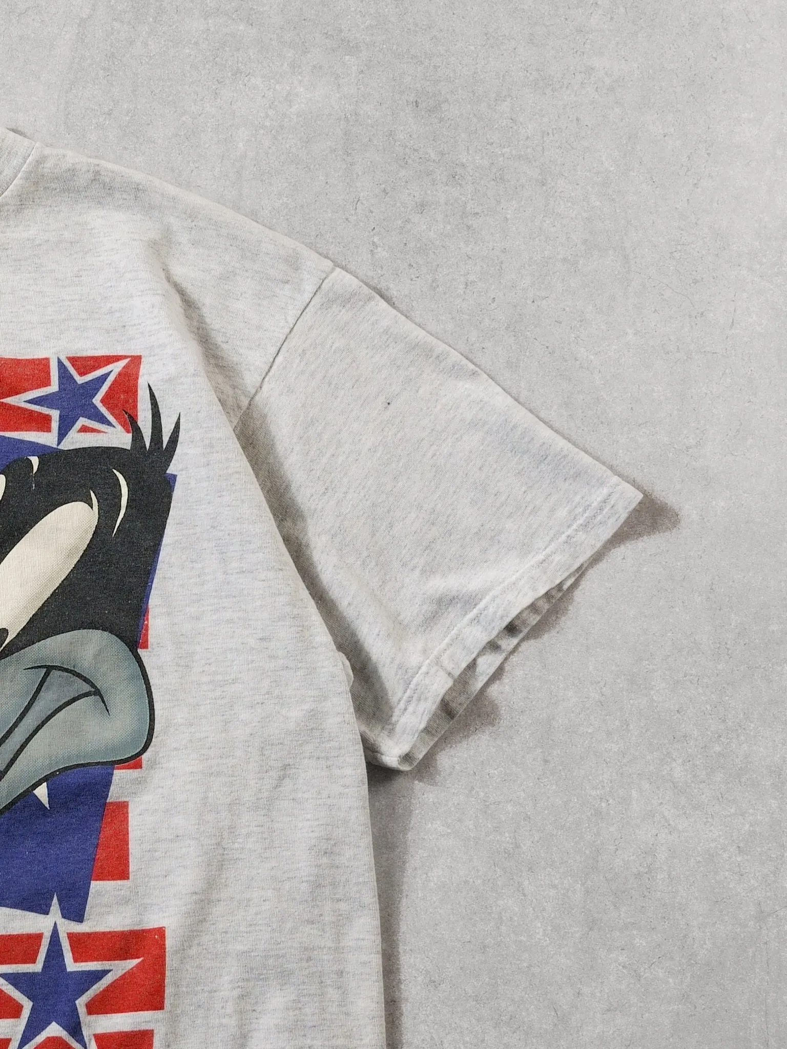 Vintage 95' Grey Bugs Bunny and Daffy Duck Stars Tee (L) sold by Rebalance Vintage product image thumbnail 3