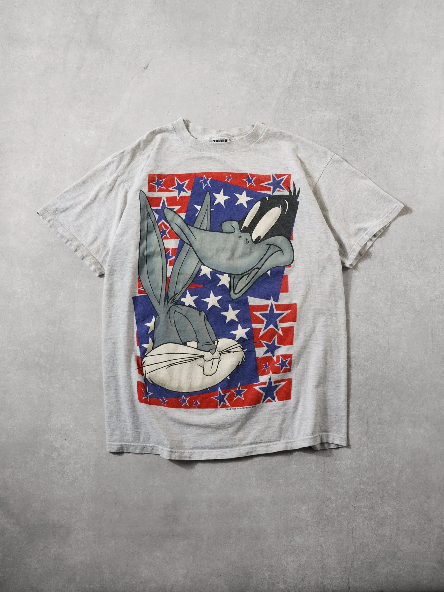 Vintage 95' Grey Bugs Bunny and Daffy Duck Stars Tee (L) sold by Rebalance Vintage