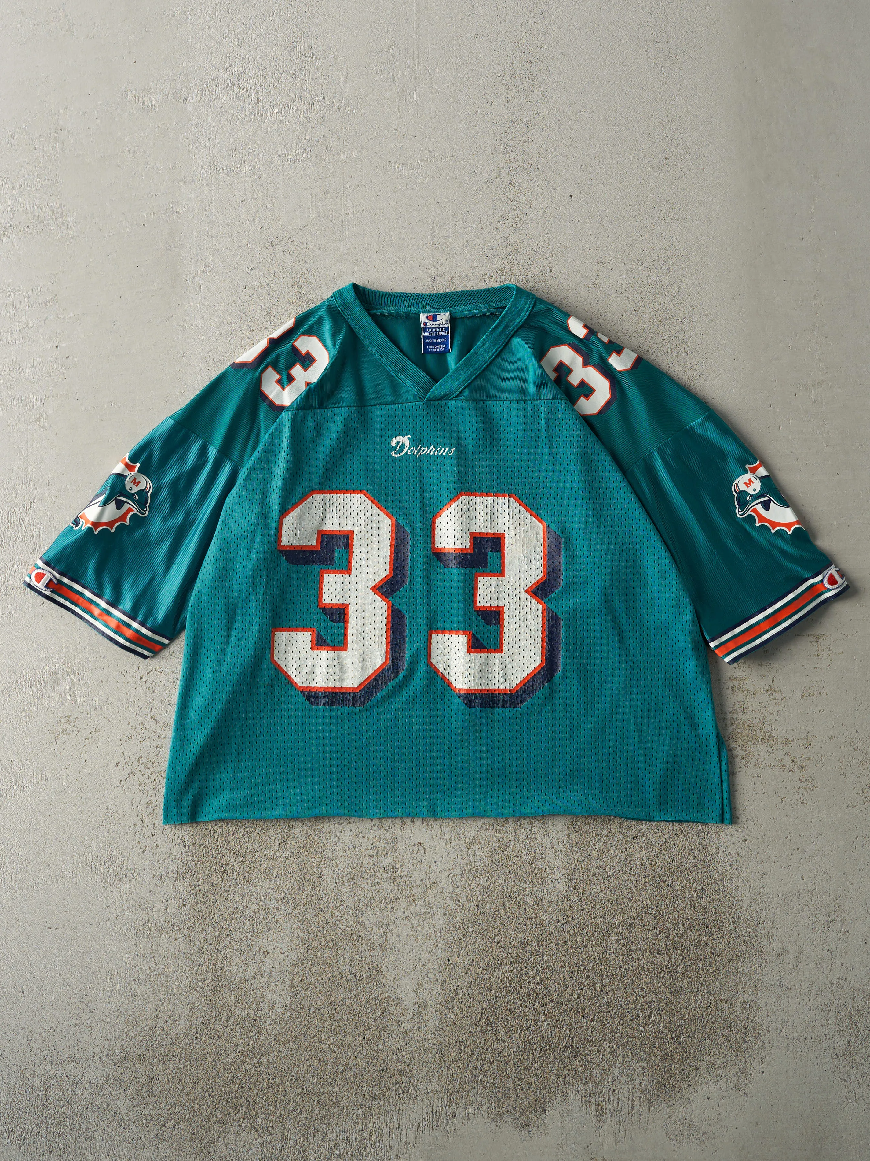 Vintage 90s Teal Miami Dolphins #33 Karim Abdul-Jabbar Cropped Football Jersey (L) sold by Rebalance Vintage
