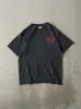 Vintage Y2K Black Nike Sports Tee (S/M) sold by Rebalance Vintage