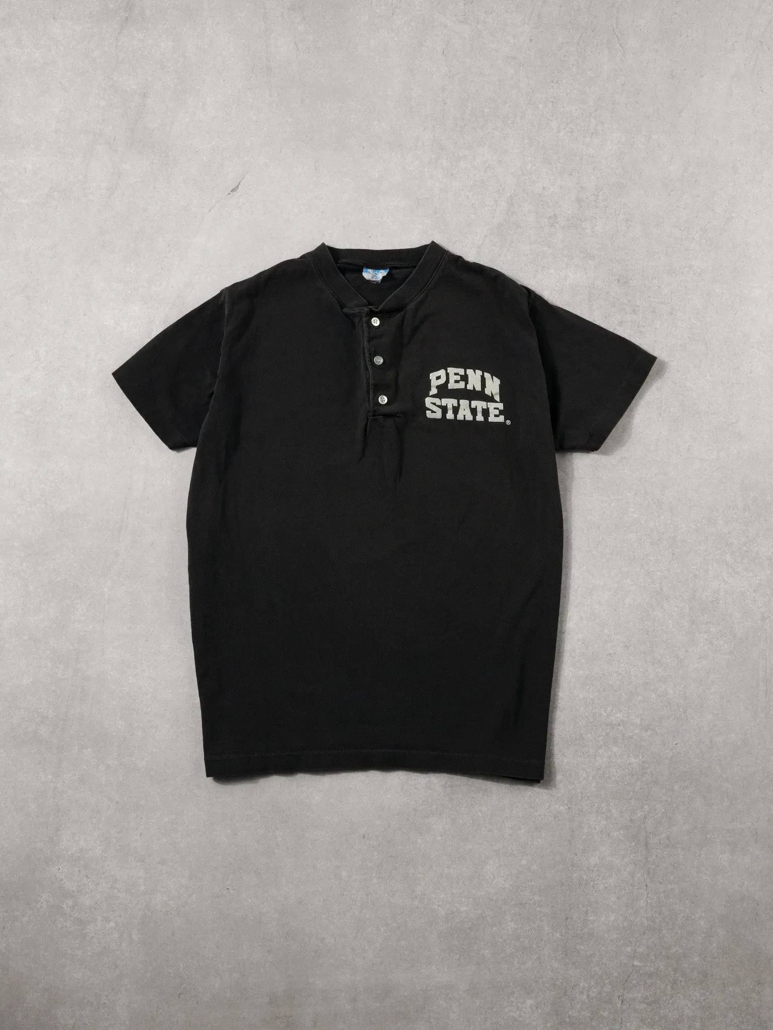 Vintage 90s Sunfaded Black Penn State Disney Button Up Tee (S) sold by Rebalance Vintage