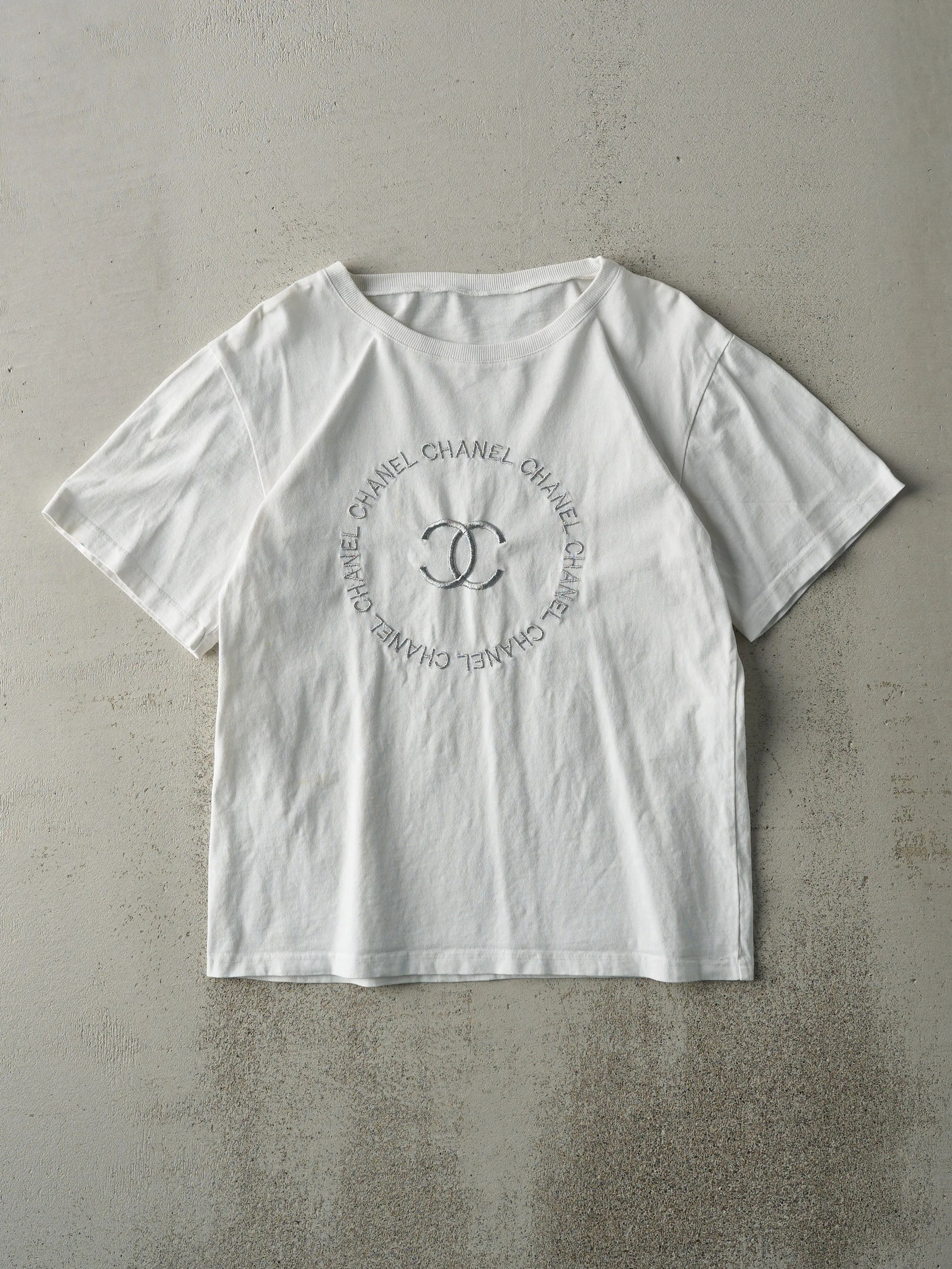 Vintage Y2K White Bootleg Embroidered Chanel Tee (S) sold by Rebalance Vintage