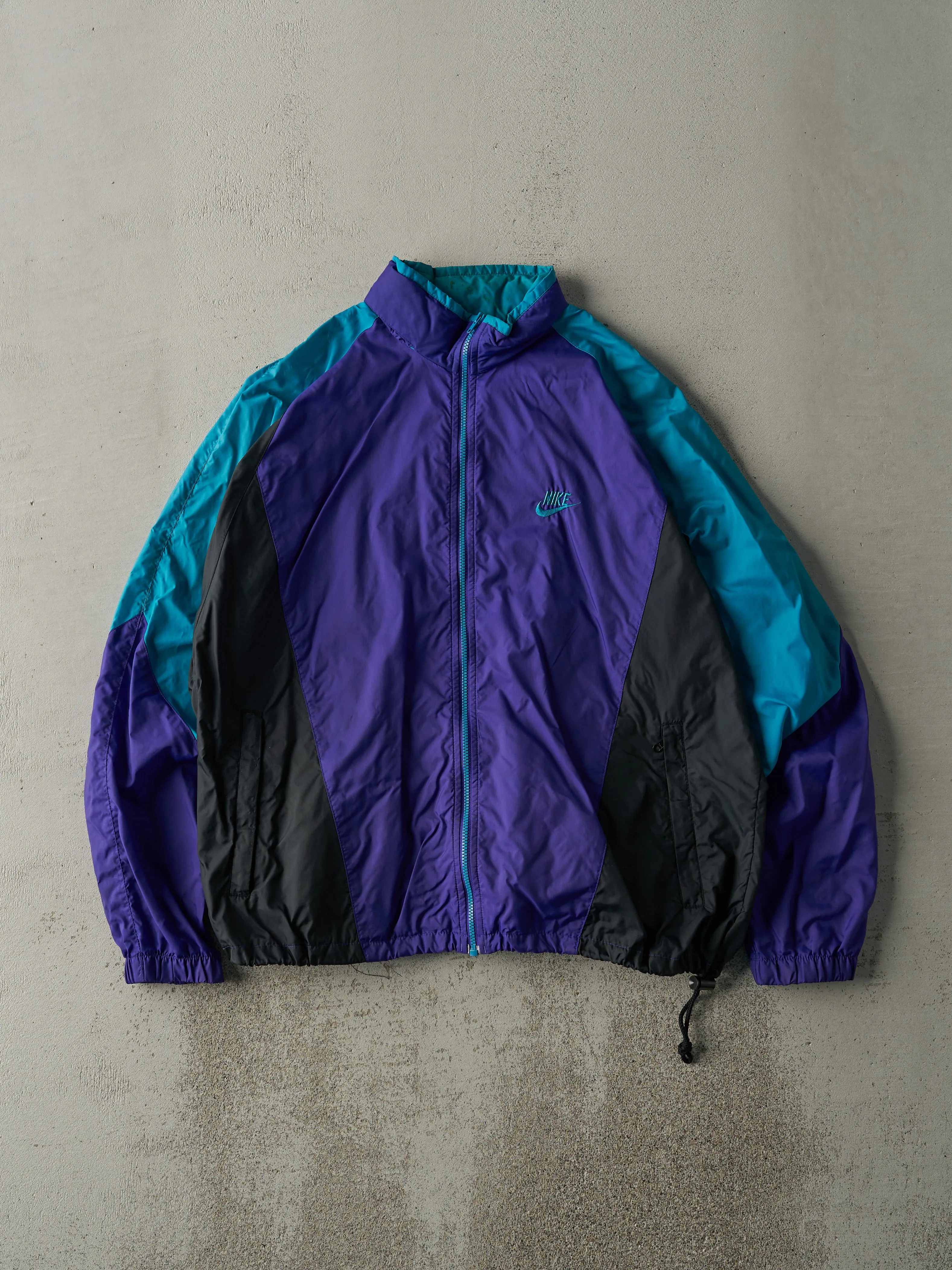 Vintage 80s Teal, Purple & Black Nike Windbreaker Jacket (M) sold by Rebalance Vintage