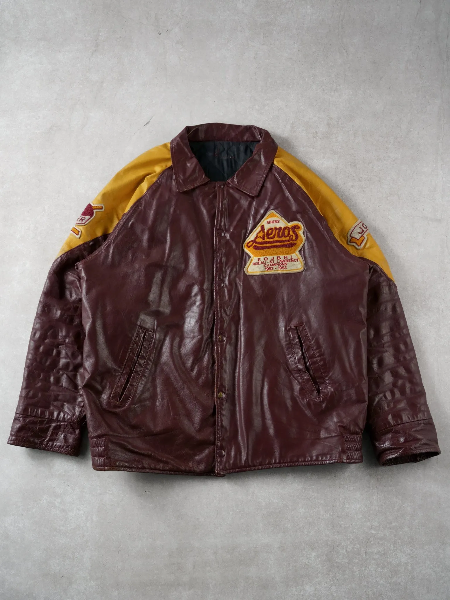 Vintage 93' Maroon and Yellow Athens Aeros Leather Jacket (L) sold by Rebalance Vintage
