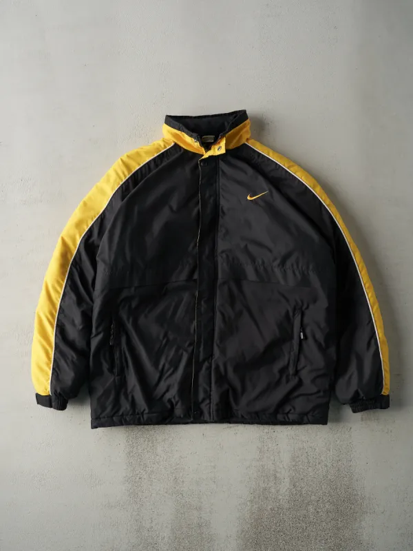 Vintage 90s Black and Yellow Nike Puffer Jacket (XL) sold by Rebalance Vintage