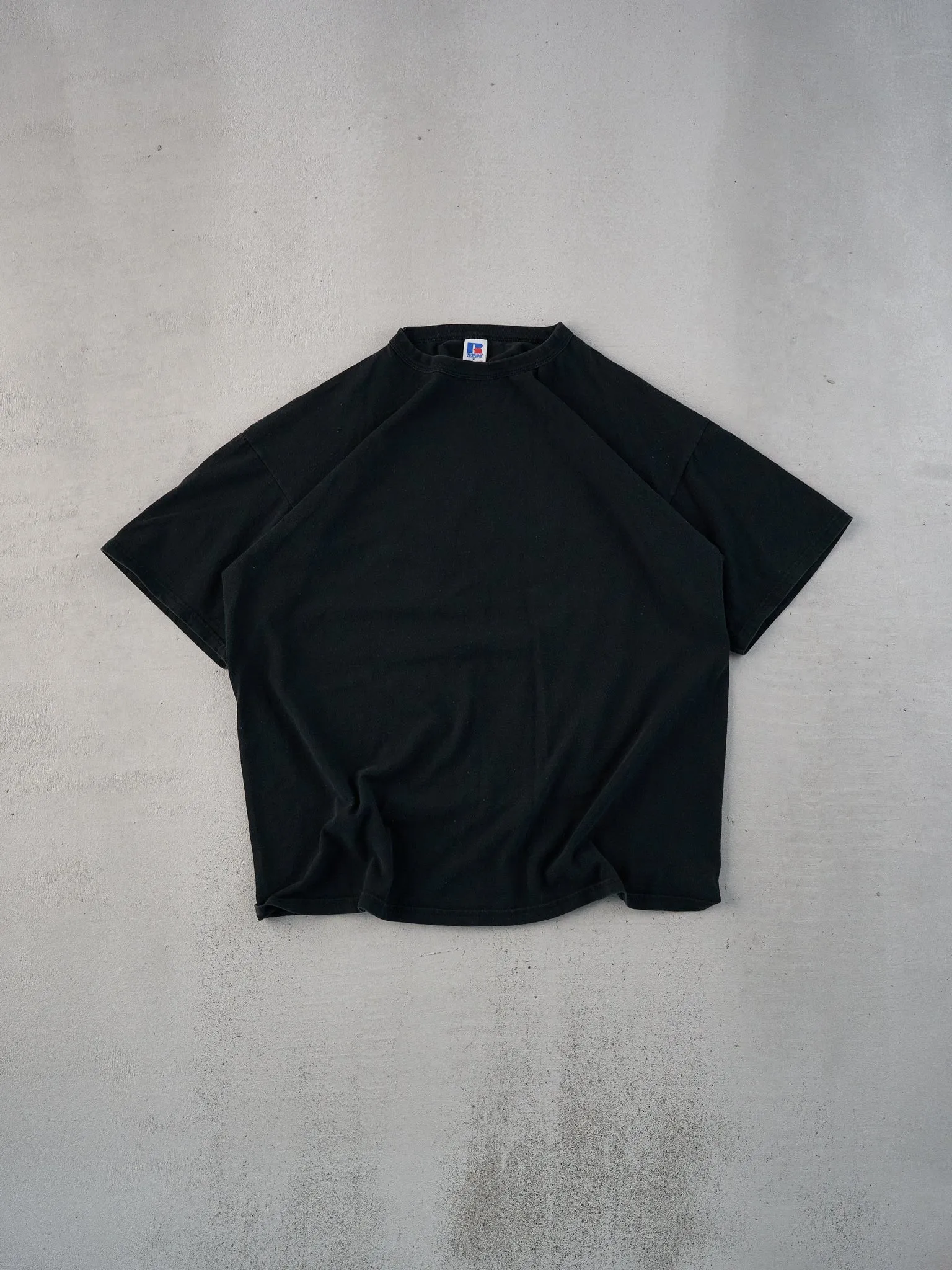 Vintage 90s Black Russell Athletics Blank Tee (L) sold by Rebalance Vintage