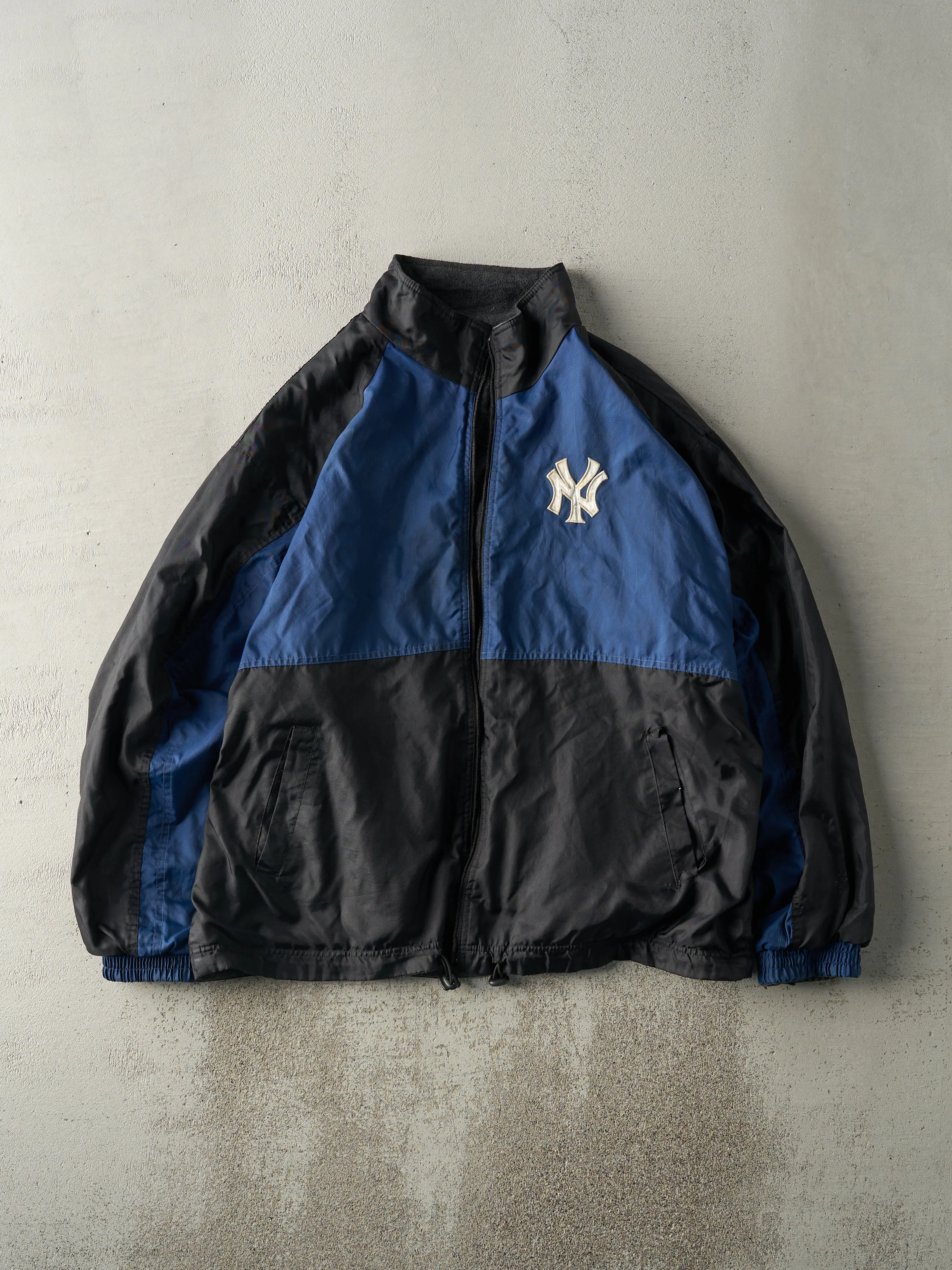 Vintage 90s Navy Blue, Black & Grey New York Yankees Fleece Lined Jacket (XL) sold by Rebalance Vintage
