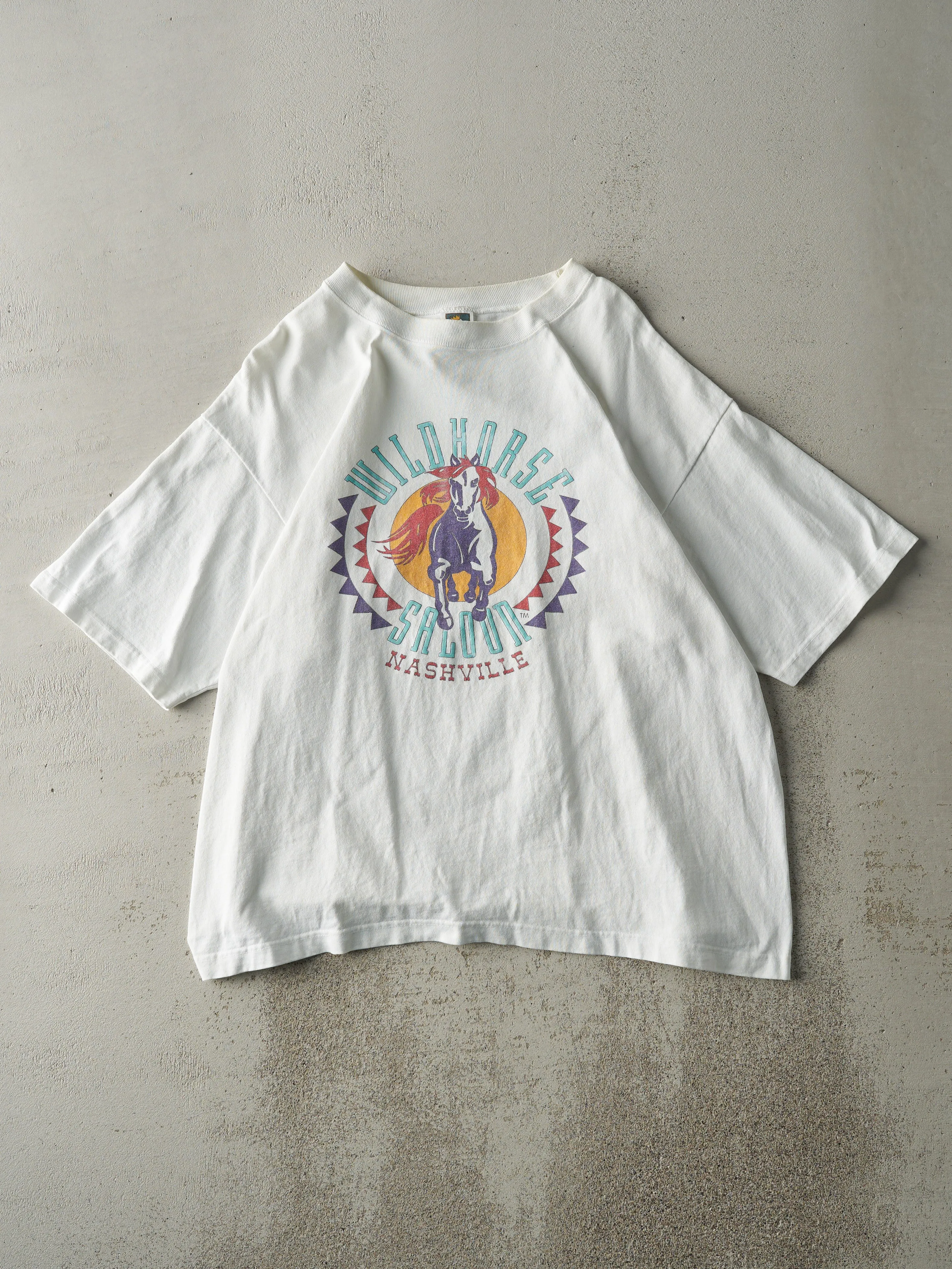 Vintage 90s White Wildhorse Saloon Tee (L) sold by Rebalance Vintage