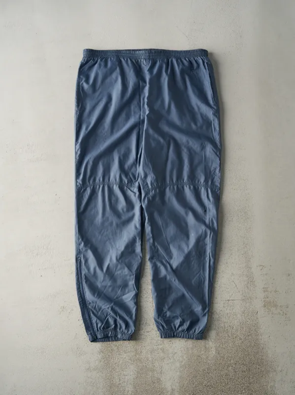 Vintage 90s Slate Blue Embroidered Tonal Nike Windbreaker Pants (38x32.5) sold by Rebalance Vintage