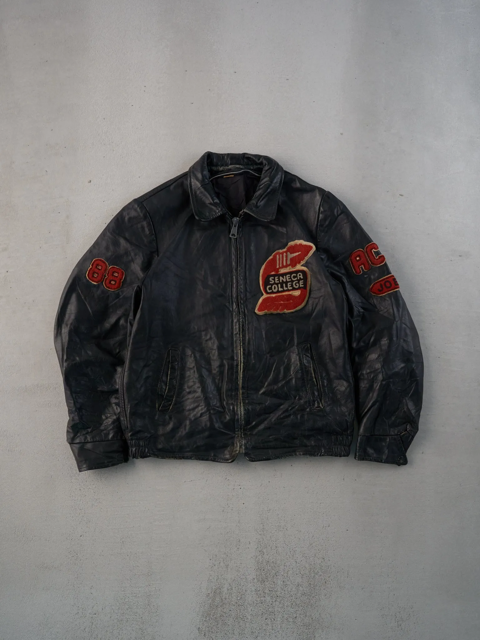 Vintage 88' Black Seneca College Collared Leather Jacket (M) sold by Rebalance Vintage