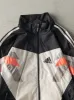 Vintage 90s Black, Grey, White & Orange Adidas Windbreaker Jacket (M) sold by Rebalance Vintage