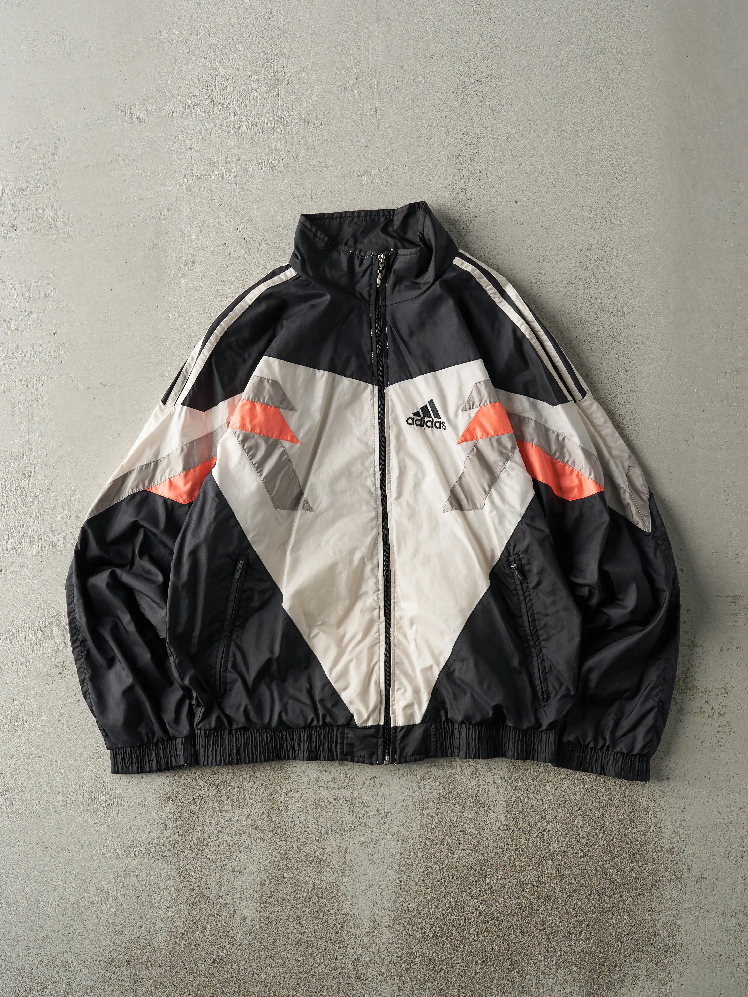 Vintage 90s Black, Grey, White & Orange Adidas Windbreaker Jacket (M) sold by Rebalance Vintage