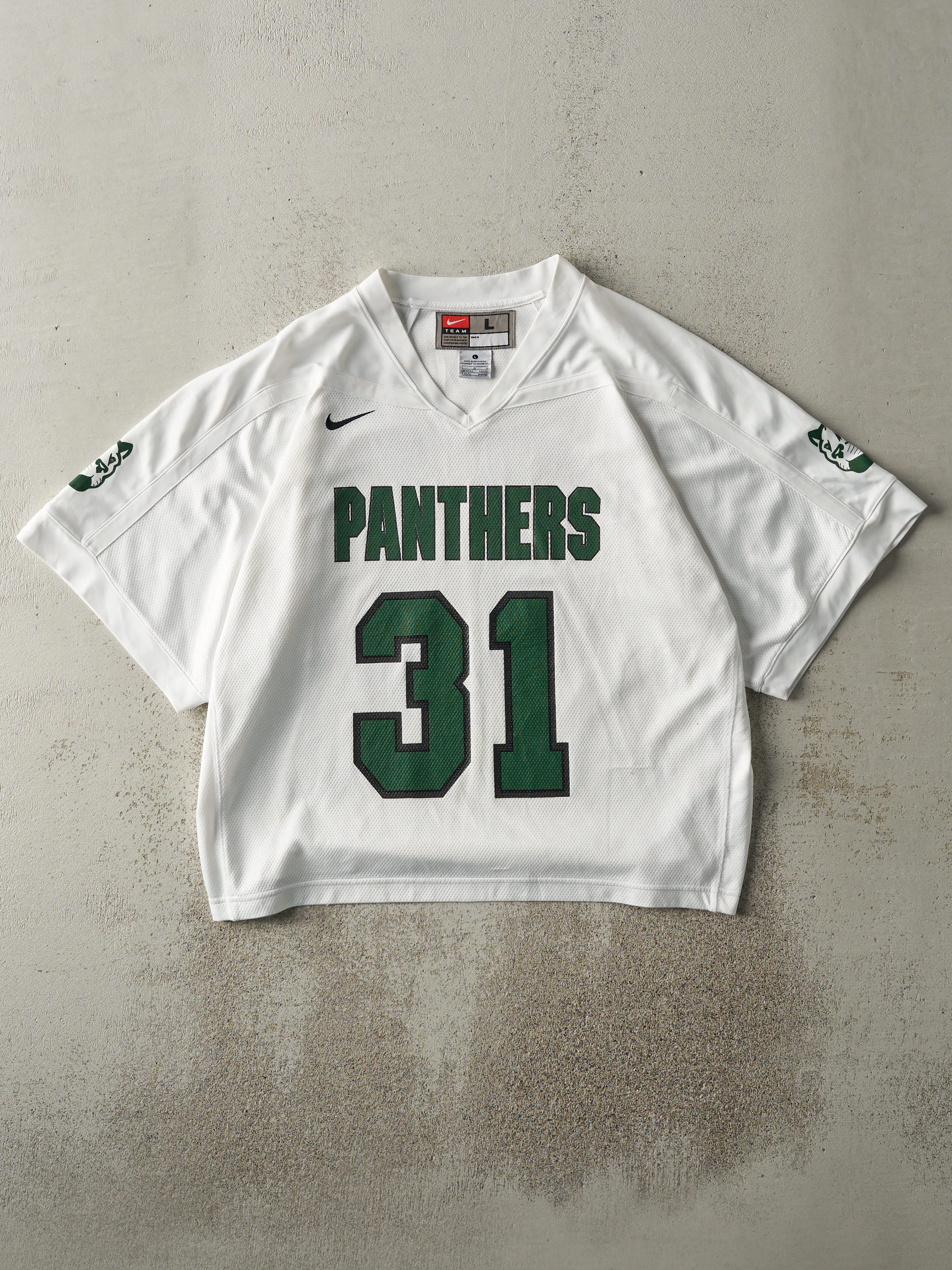 Vintage 90s White & Green Panthers #31 Jersey (L) sold by Rebalance Vintage