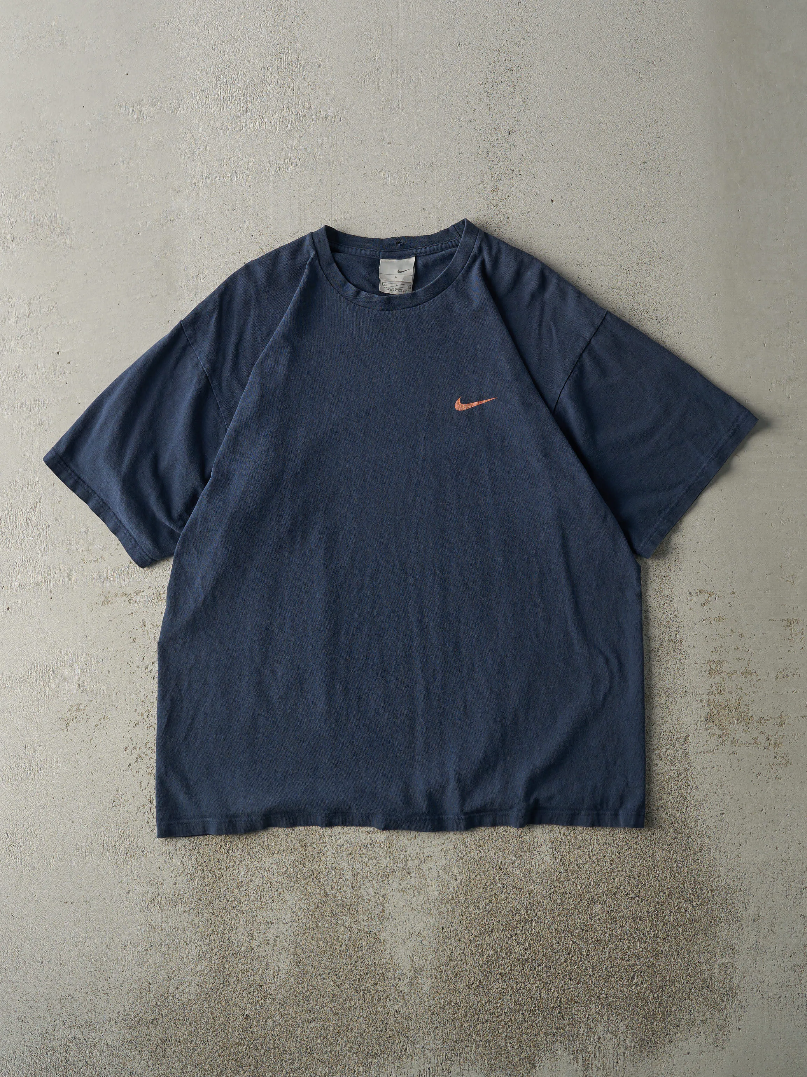 Vintage Y2K Navy & Orange Nike Swoosh Tee (L) sold by Rebalance Vintage