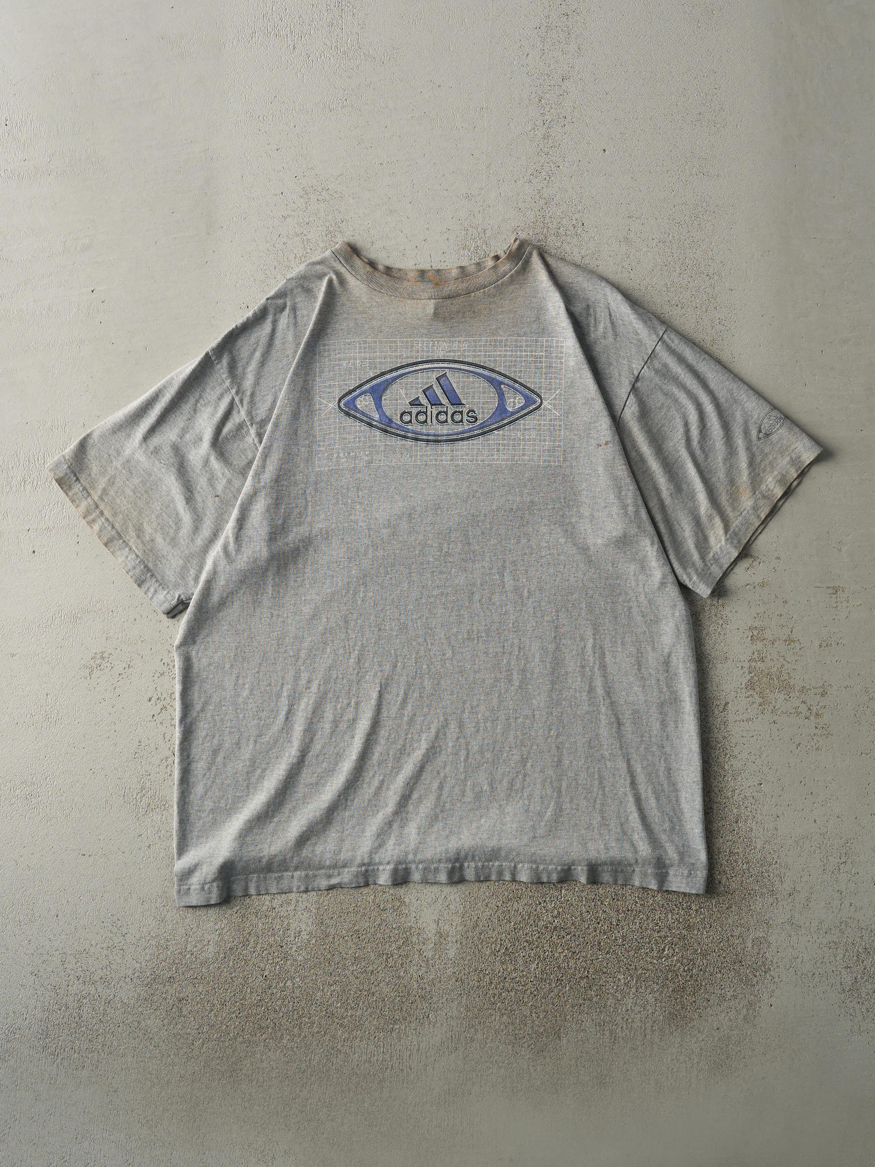 Vintage 90s Grey Adidas Logo Tee (L) sold by Rebalance Vintage