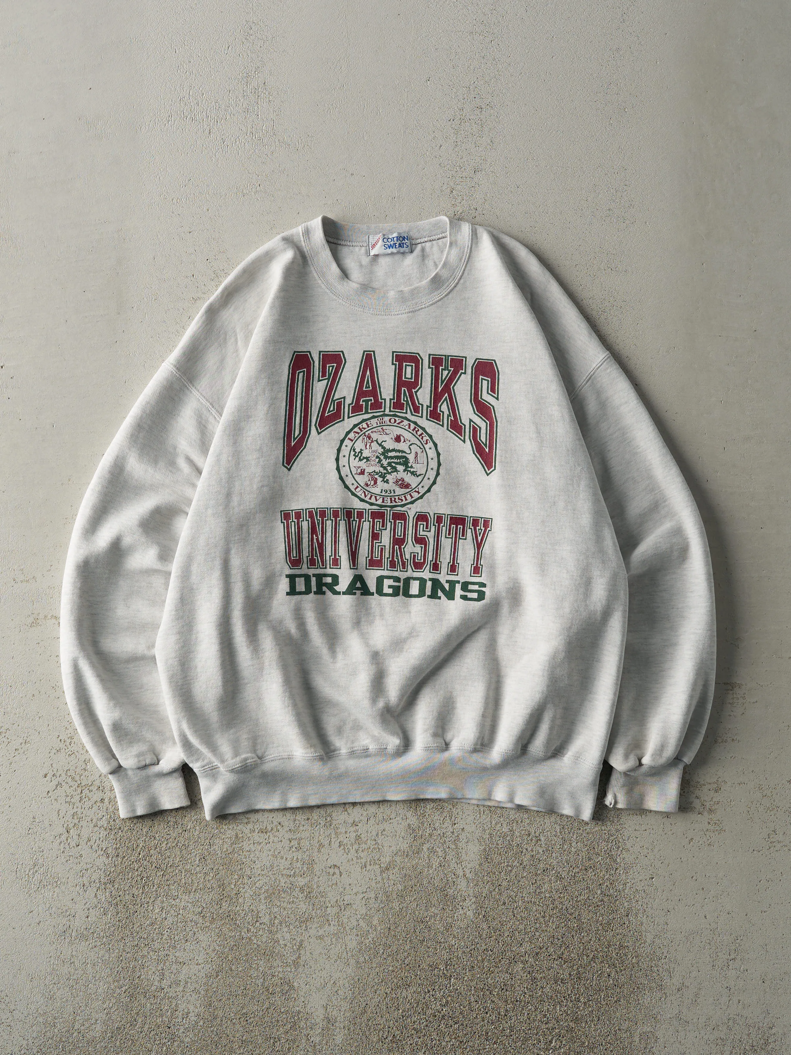 Vintage 90s Heather Grey Ozarks University Dragons Crewneck (L) sold by Rebalance Vintage