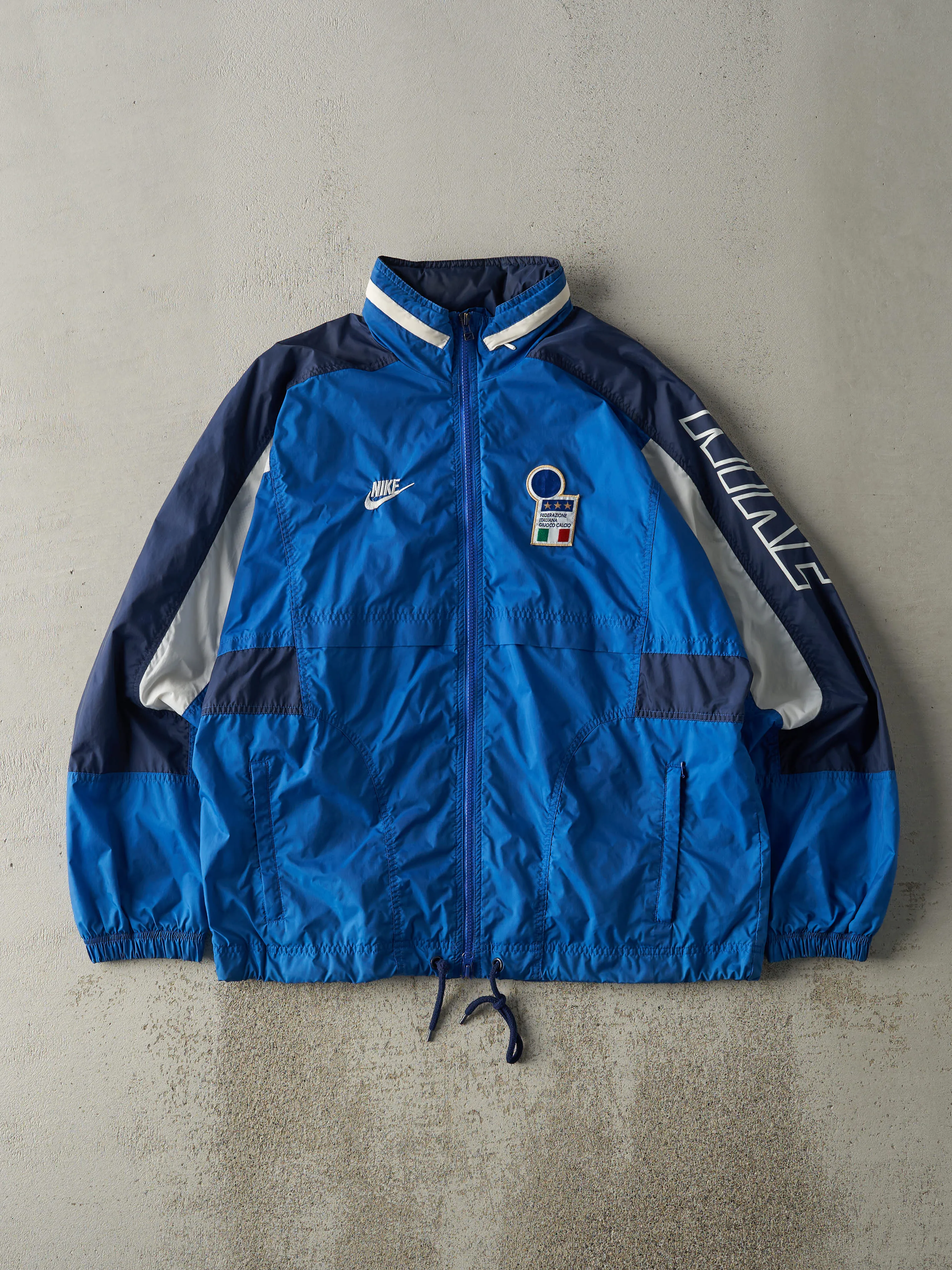 Vintage 90s Blue, Black & White Nike Italia Windbreaker Jacket (M/L) sold by Rebalance Vintage