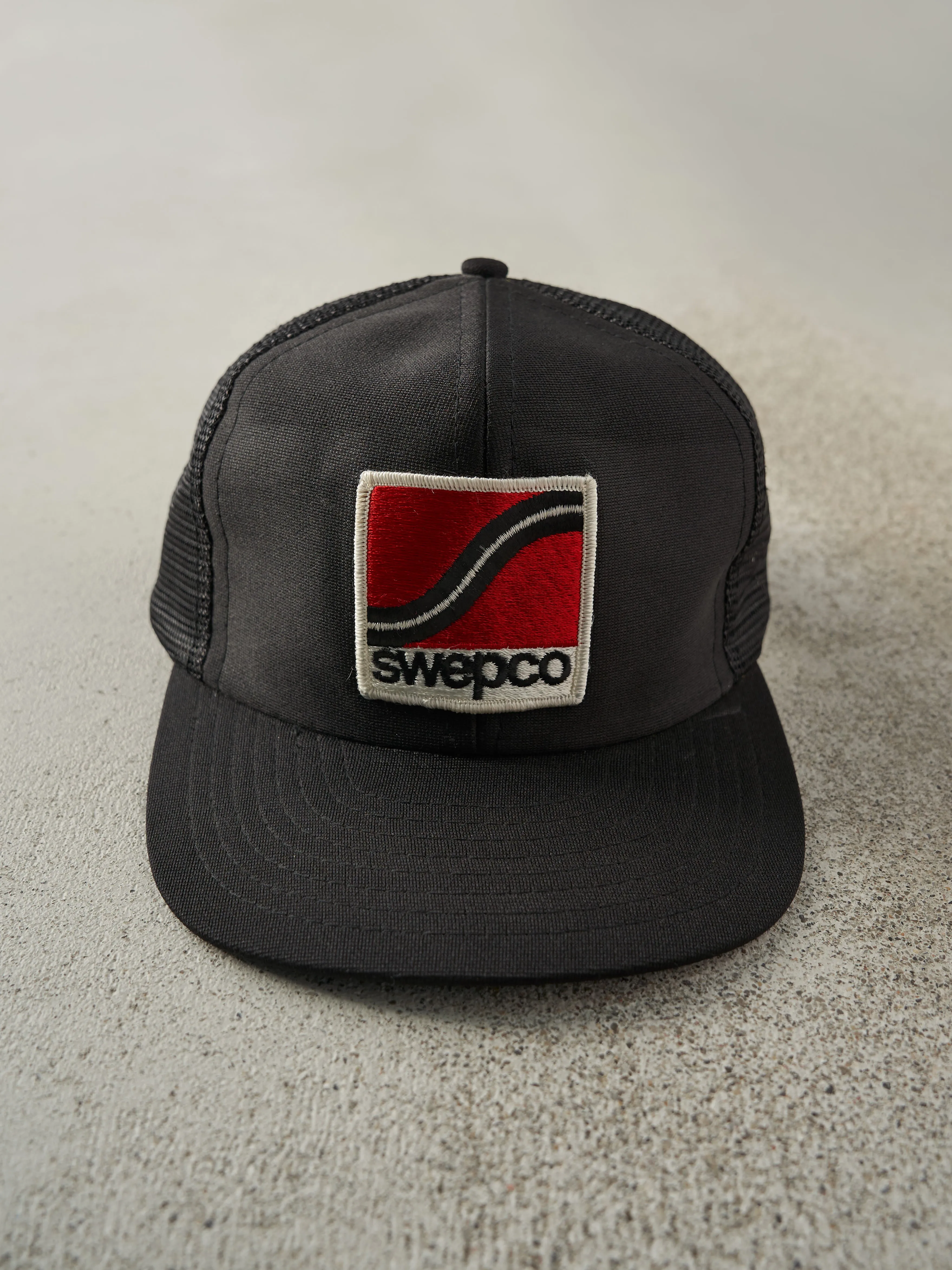 Vintage 90s Black Swepco Patch Trucker Hat sold by Rebalance Vintage
