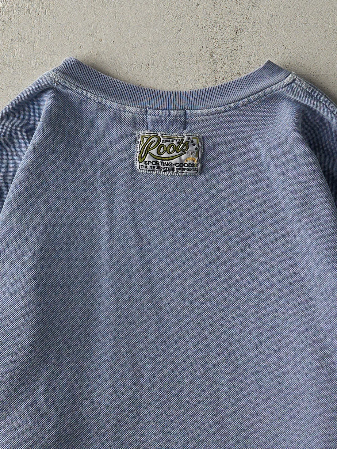 Vintage 90s Washed Blue Roots NHLPA Textured Crewneck (L) sold by Rebalance Vintage product image thumbnail 4