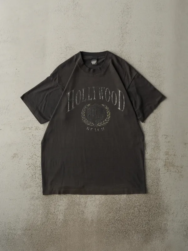 Vintage 90s Faded Black Hollywood Beach Single Stitch Tee (M/L) sold by Rebalance Vintage