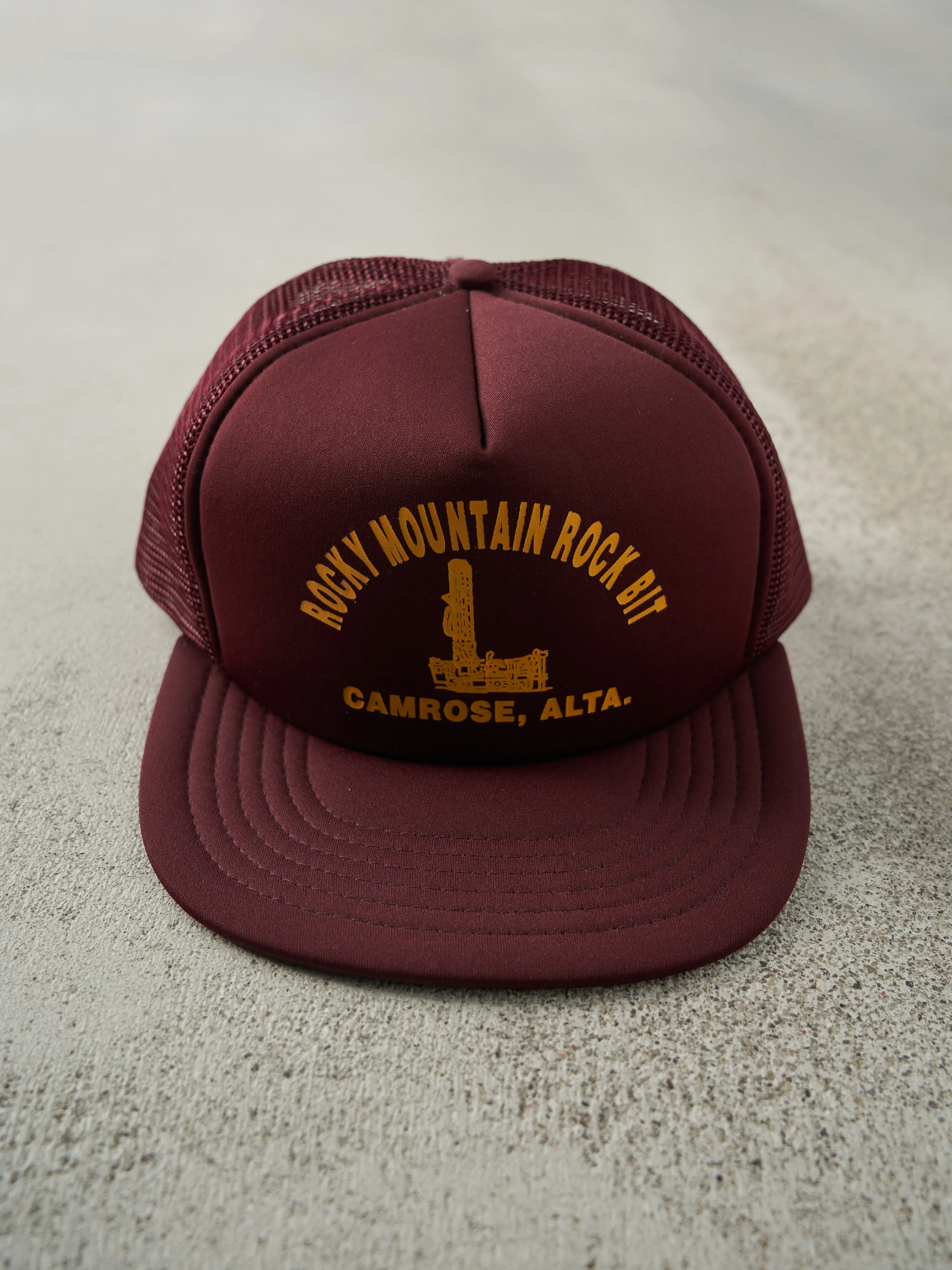 Vintage 80s Burgundy Rocky Mountain Rock Bit Foam Trucker Hat sold by Rebalance Vintage