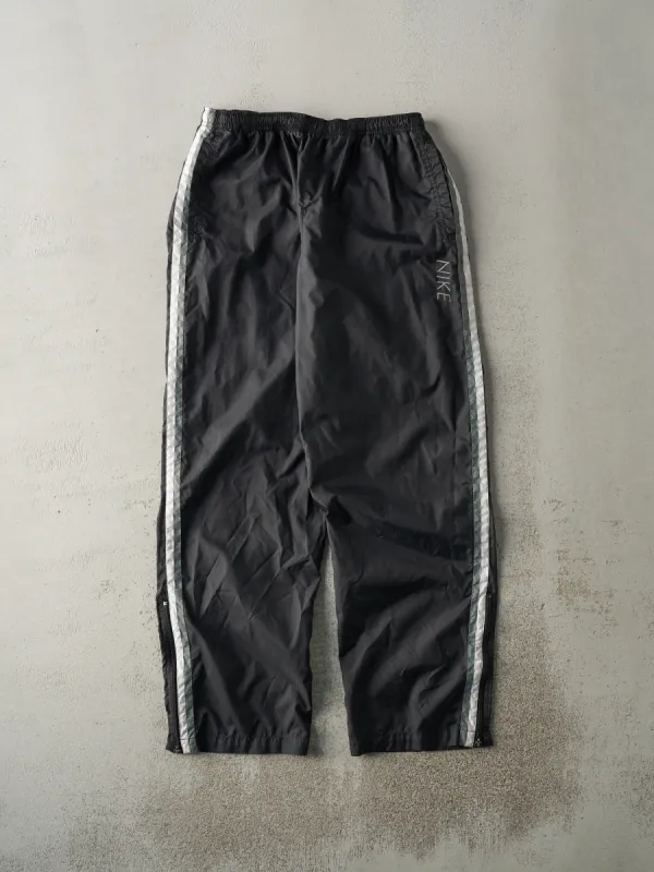 Vintage Y2K Black & Green Nike Embroidered Windbreaker Pants (31x31) sold by Rebalance Vintage