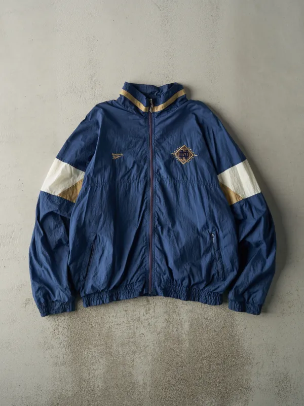 Vintage 90s Navy Blue Notre Dame Reebok Nylon Windbreaker (XL) sold by Rebalance Vintage