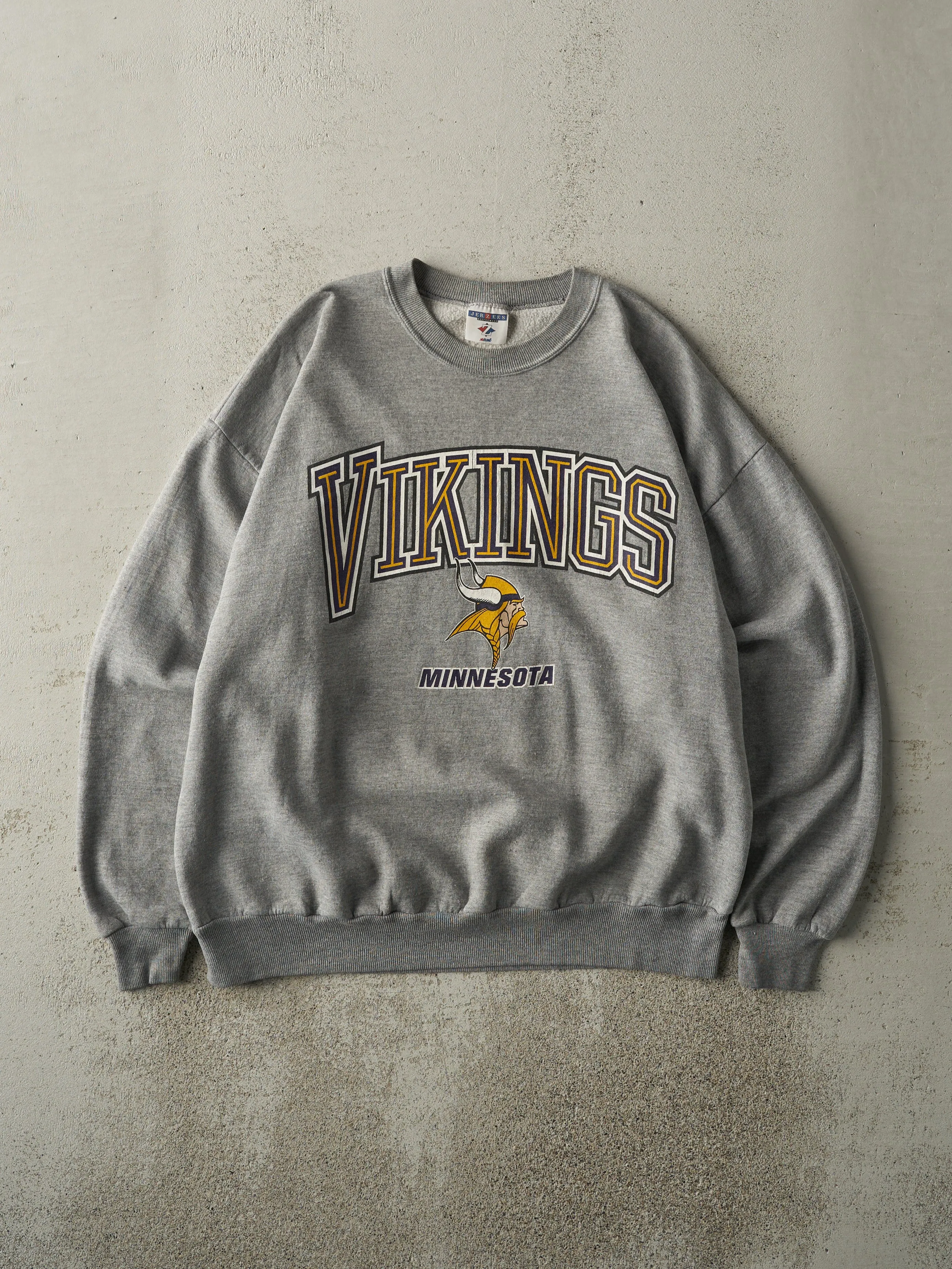 Vintage 90s Grey Minnesota Vikings Crewneck (L) sold by Rebalance Vintage