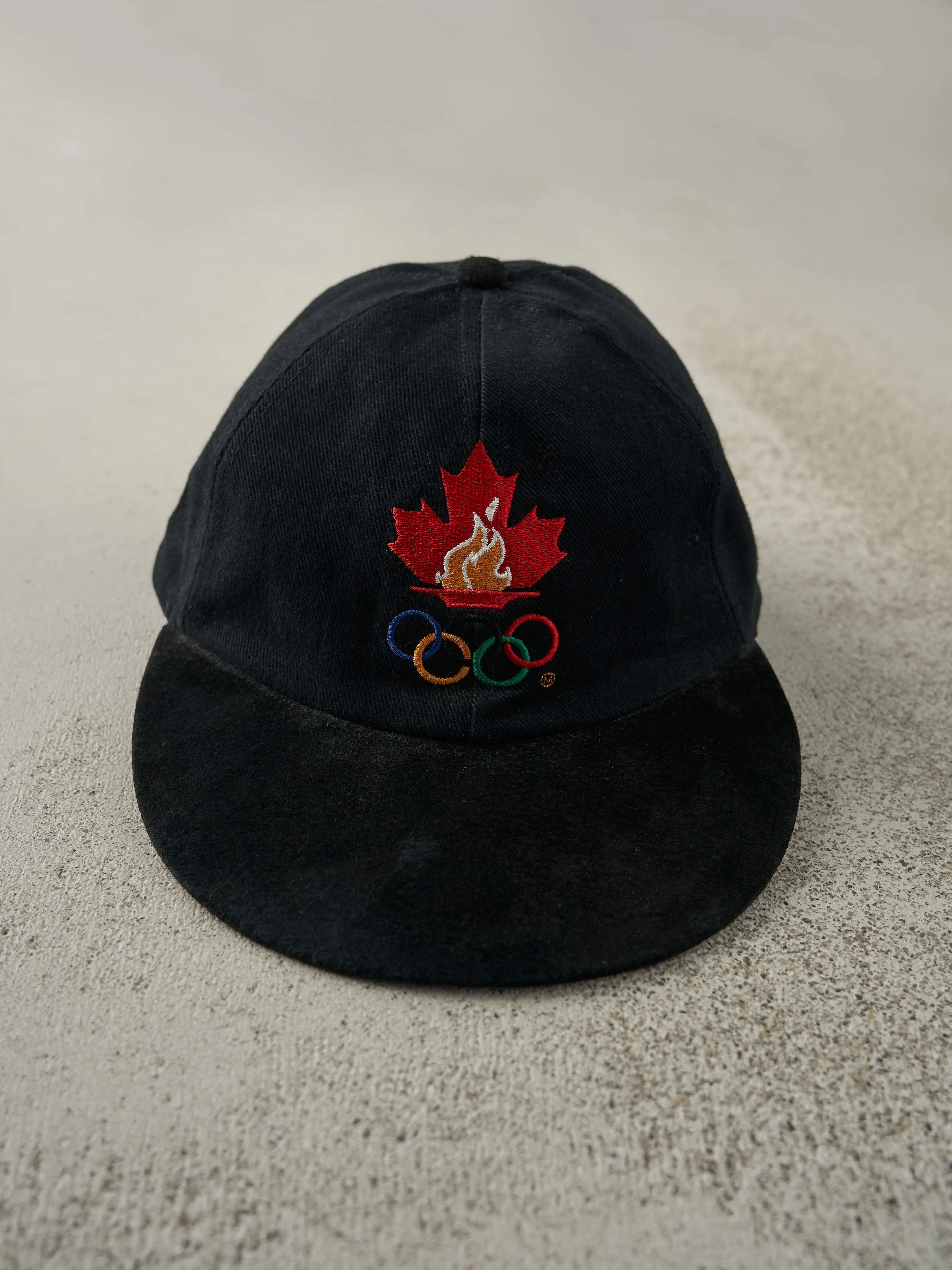 Vintage 96' Black Olympics Canada Leather Strap Back Hat sold by Rebalance Vintage