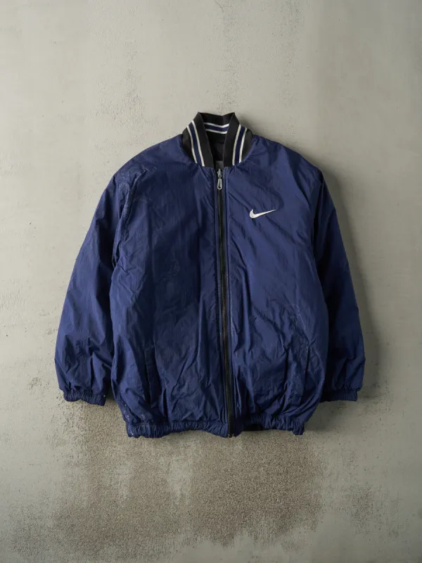Vintage 90s Navy Blue & Black Reversible Nike Puffer Jacket (L/XL) sold by Rebalance Vintage