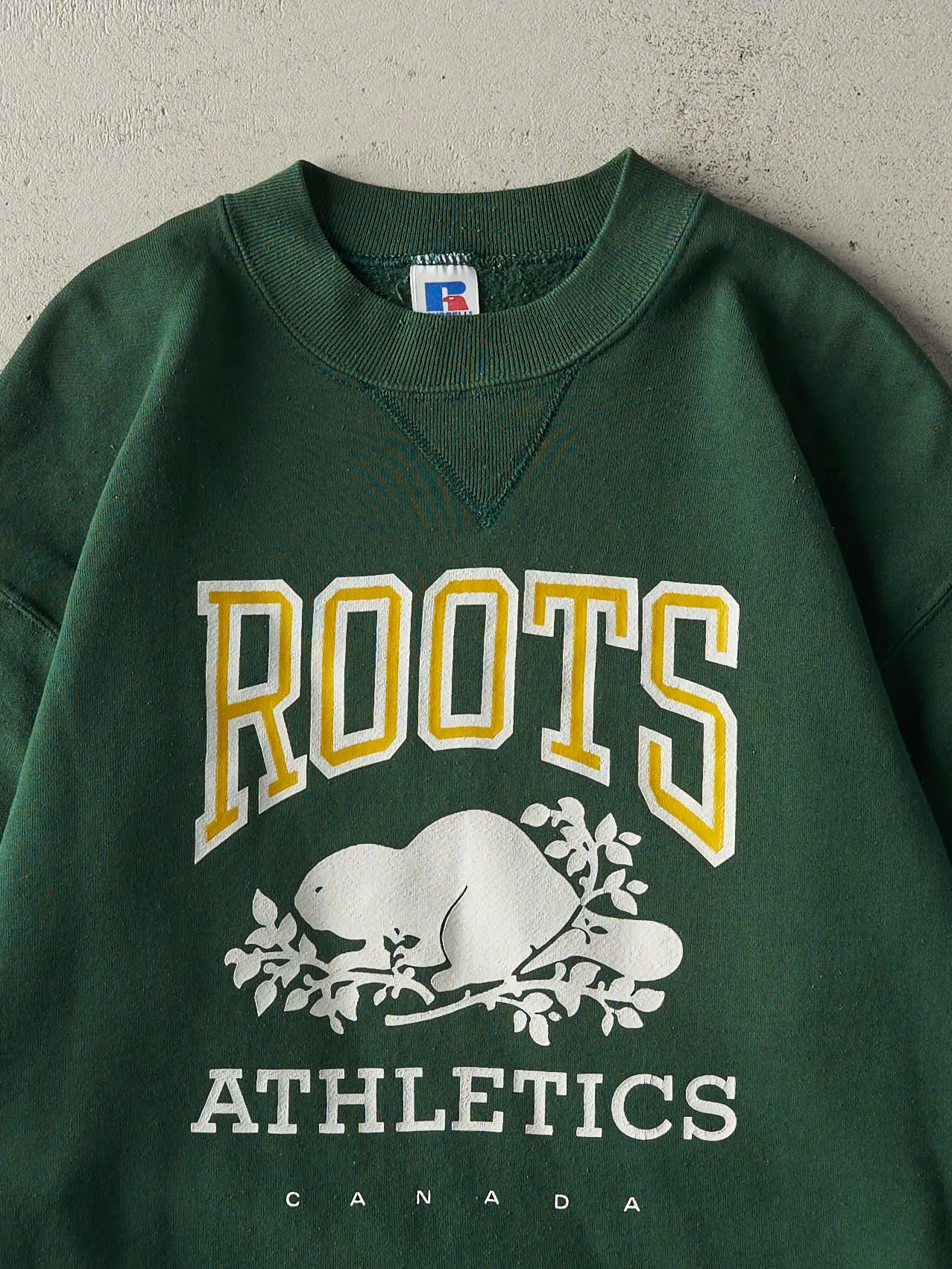 Vintage 90s Green Roots Russell Athletic Crewneck (M) sold by Rebalance Vintage product image thumbnail 2