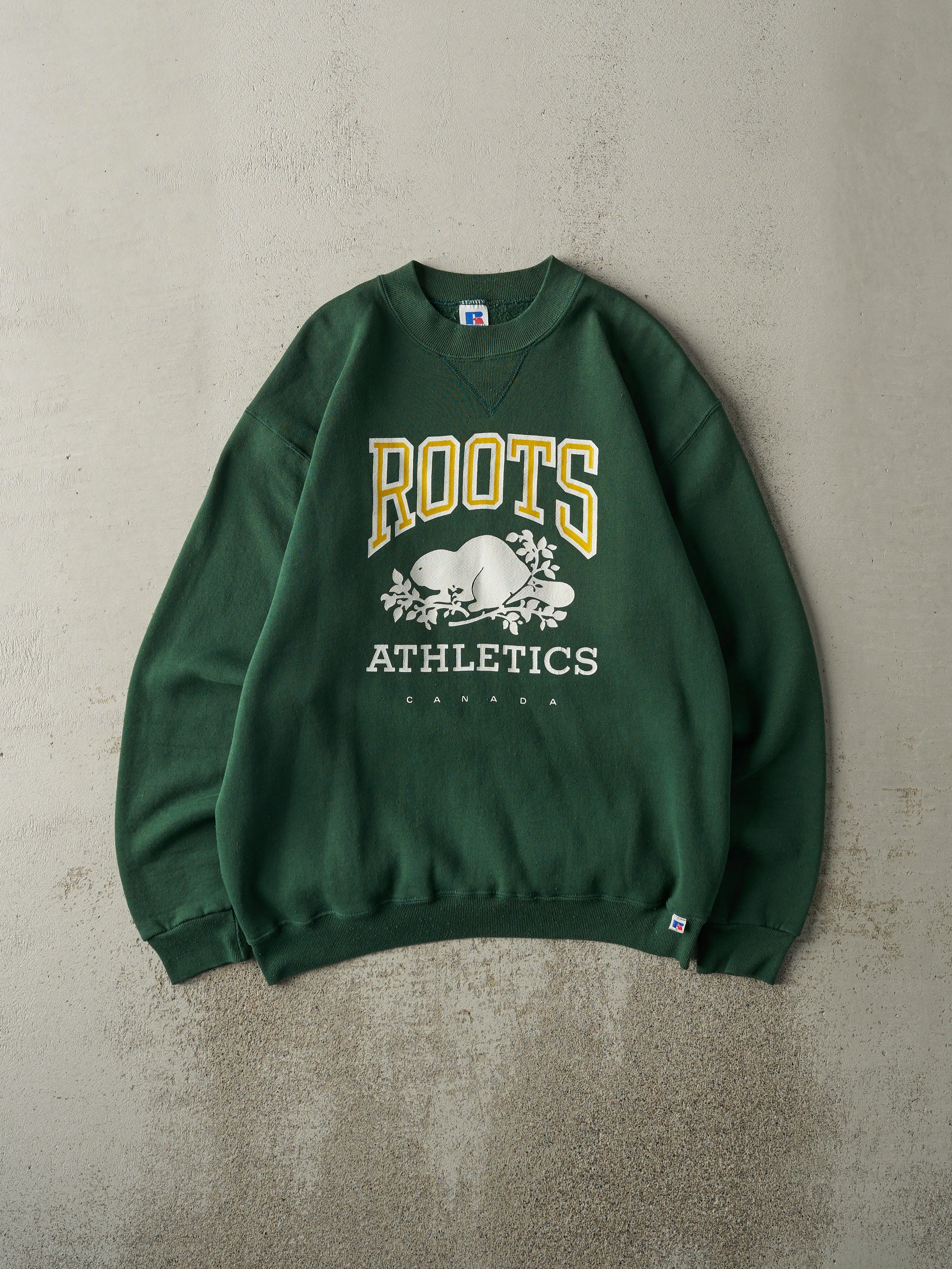 Vintage 90s Green Roots Russell Athletic Crewneck (M) sold by Rebalance Vintage