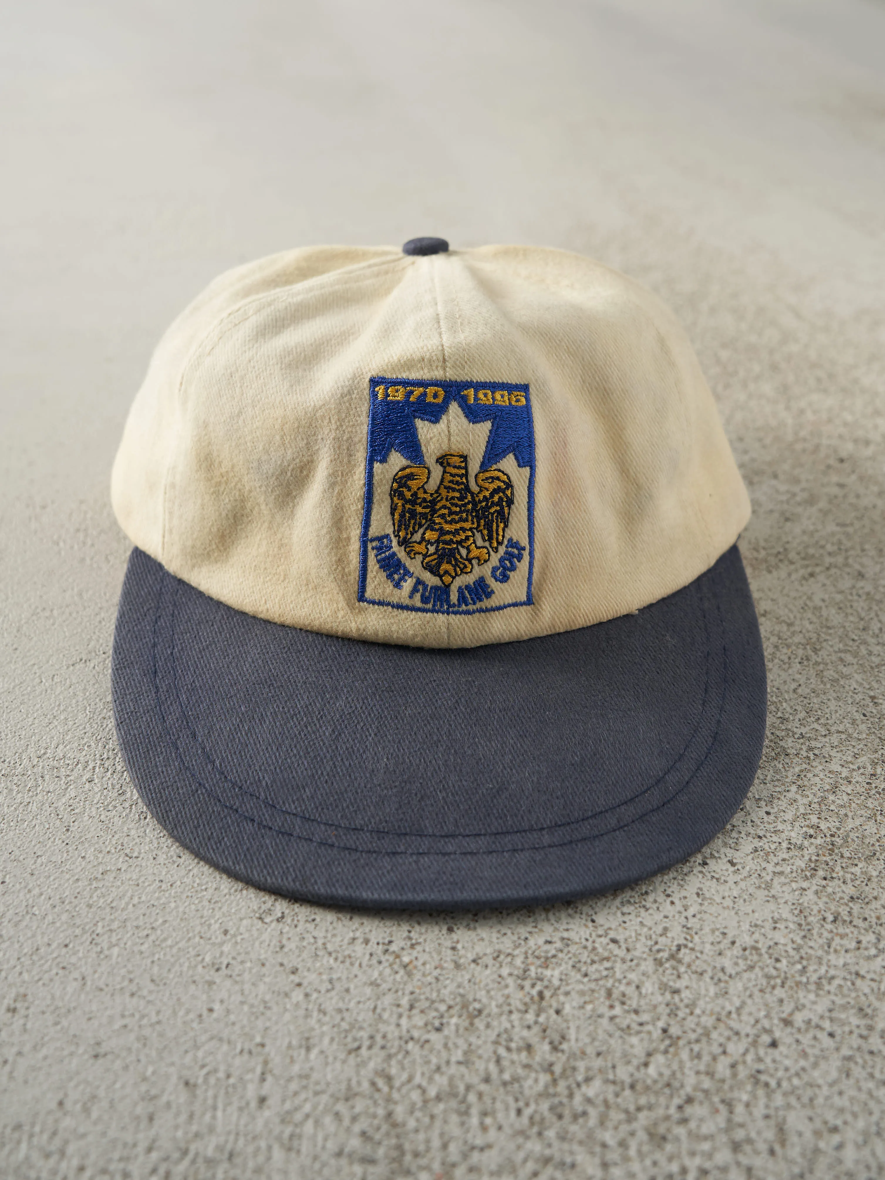 Vintage 96' Beige & Blue Embroidered Golf Leather Strap Back Hat sold by Rebalance Vintage