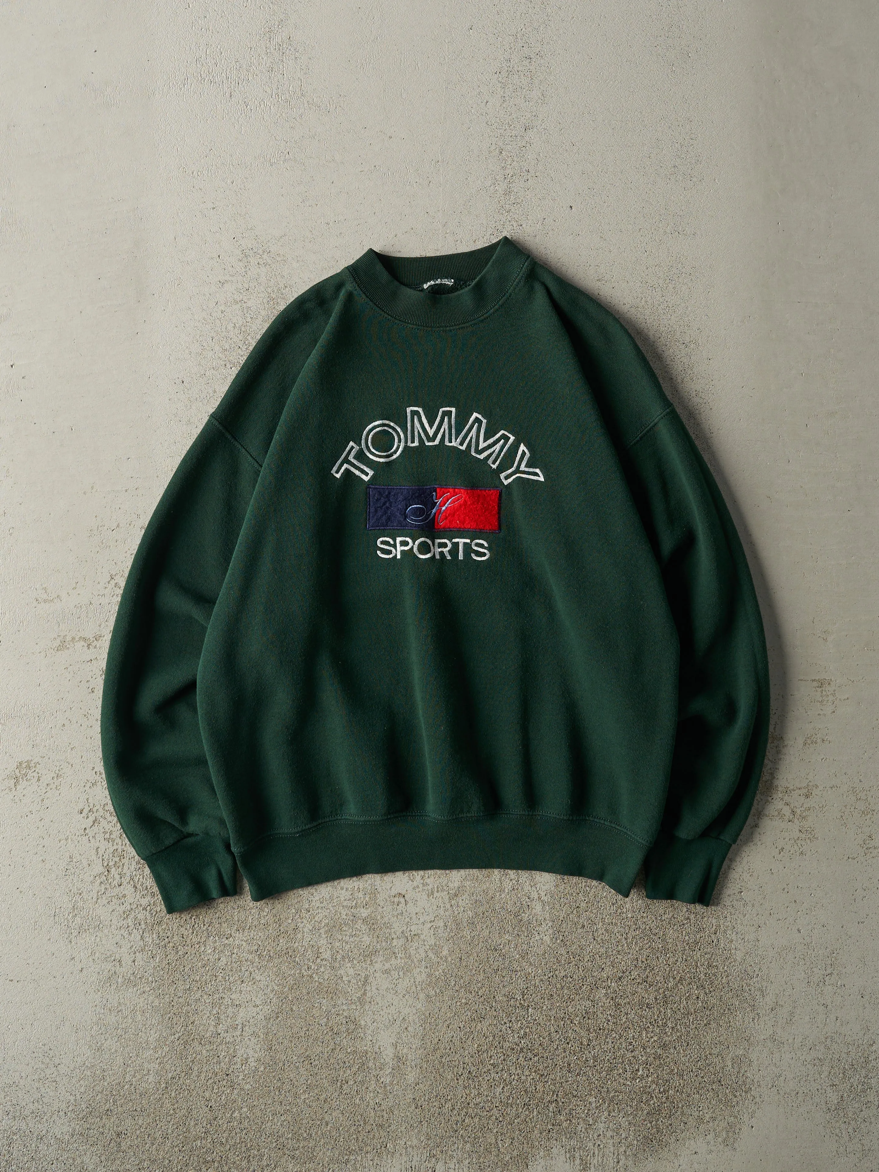 Vintage 90s Green Embroidered Tommy Hilfiger Sports Crewneck (L) sold by Rebalance Vintage