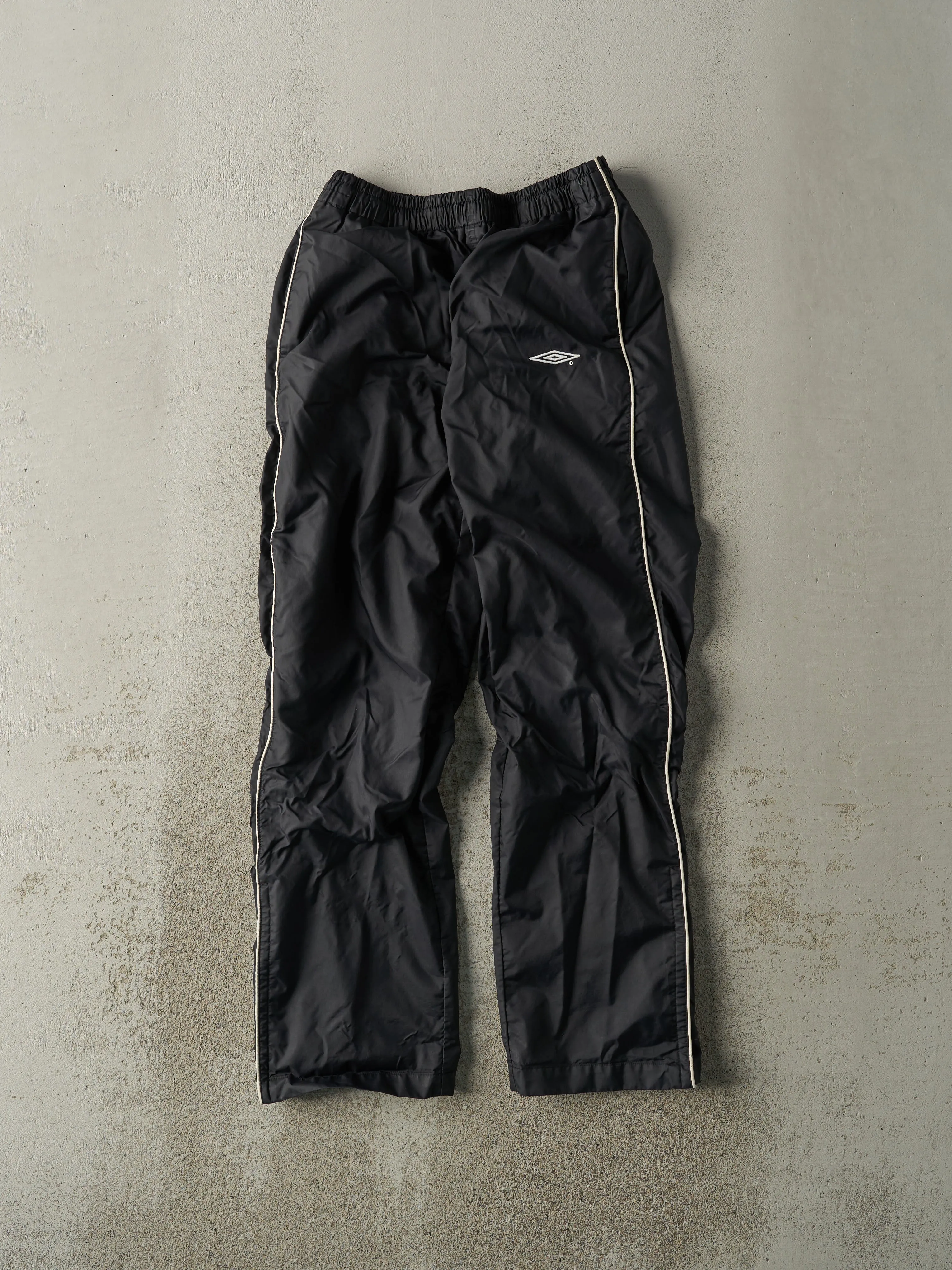 Vintage 90s Black Umbro Windbreaker Pants (26x27.5) sold by Rebalance Vintage