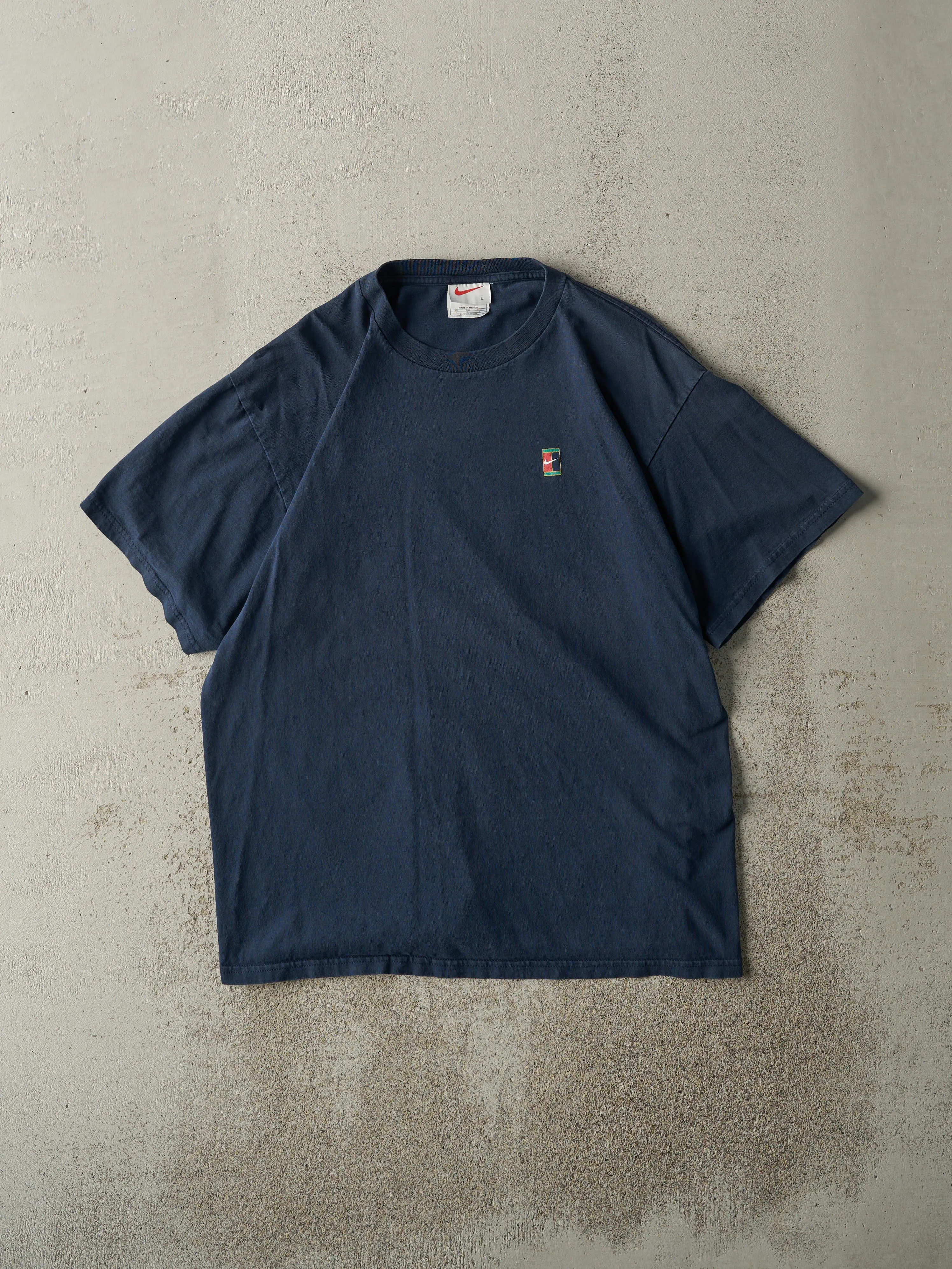 Vintage 90s Navy Blue Nike Tennis Tee (M) sold by Rebalance Vintage