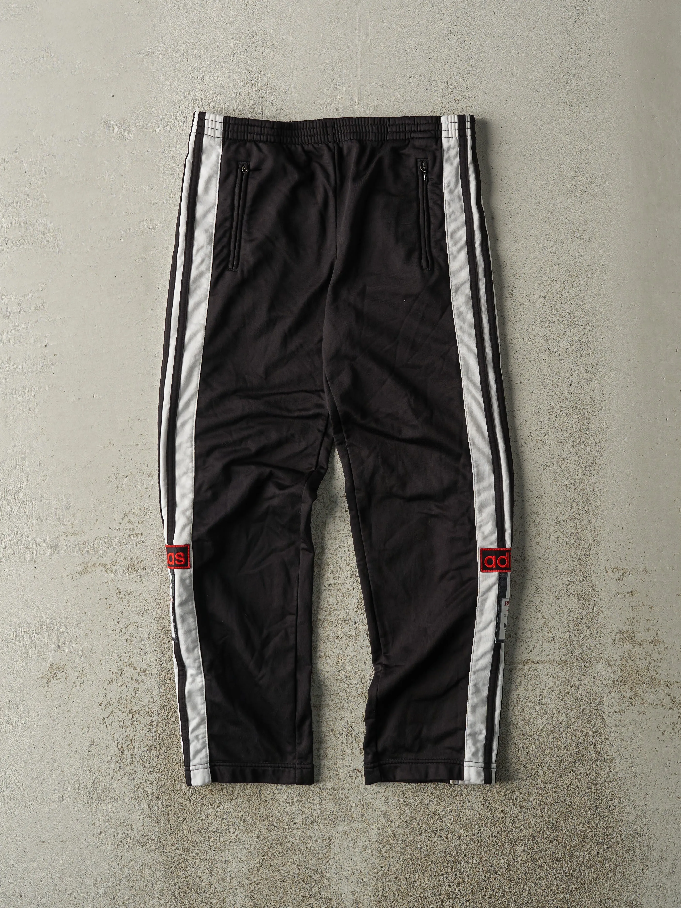 Vintage 90s Black Adidas Snap Off Track Pants (31x27.5) sold by Rebalance Vintage