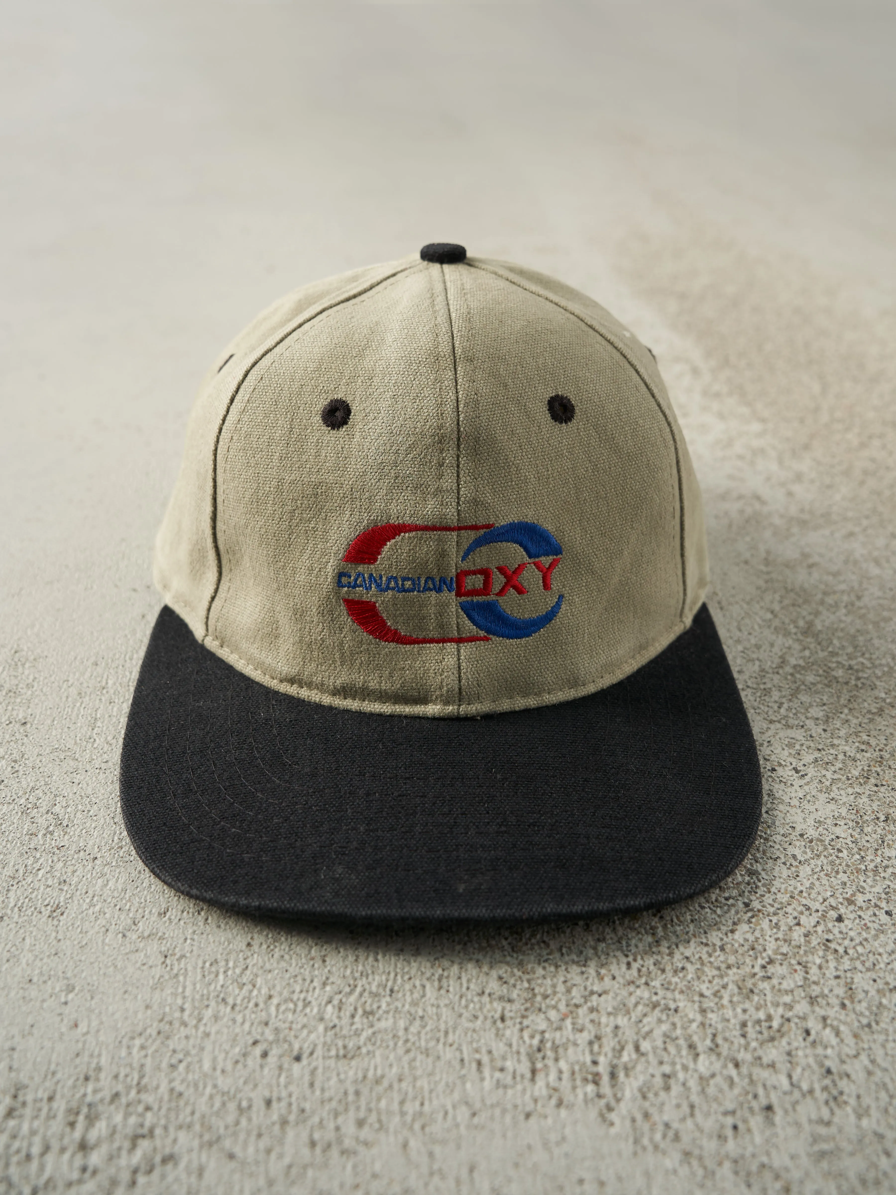 Vintage 90s Beige & Black Embroidered Canadian OXY Strapback Hat sold by Rebalance Vintage