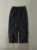 Vintage Y2K Black Nike Windbreaker Pants (30x30) sold by Rebalance Vintage