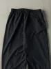 Vintage Y2K Black Nike Windbreaker Pants (30x30) sold by Rebalance Vintage