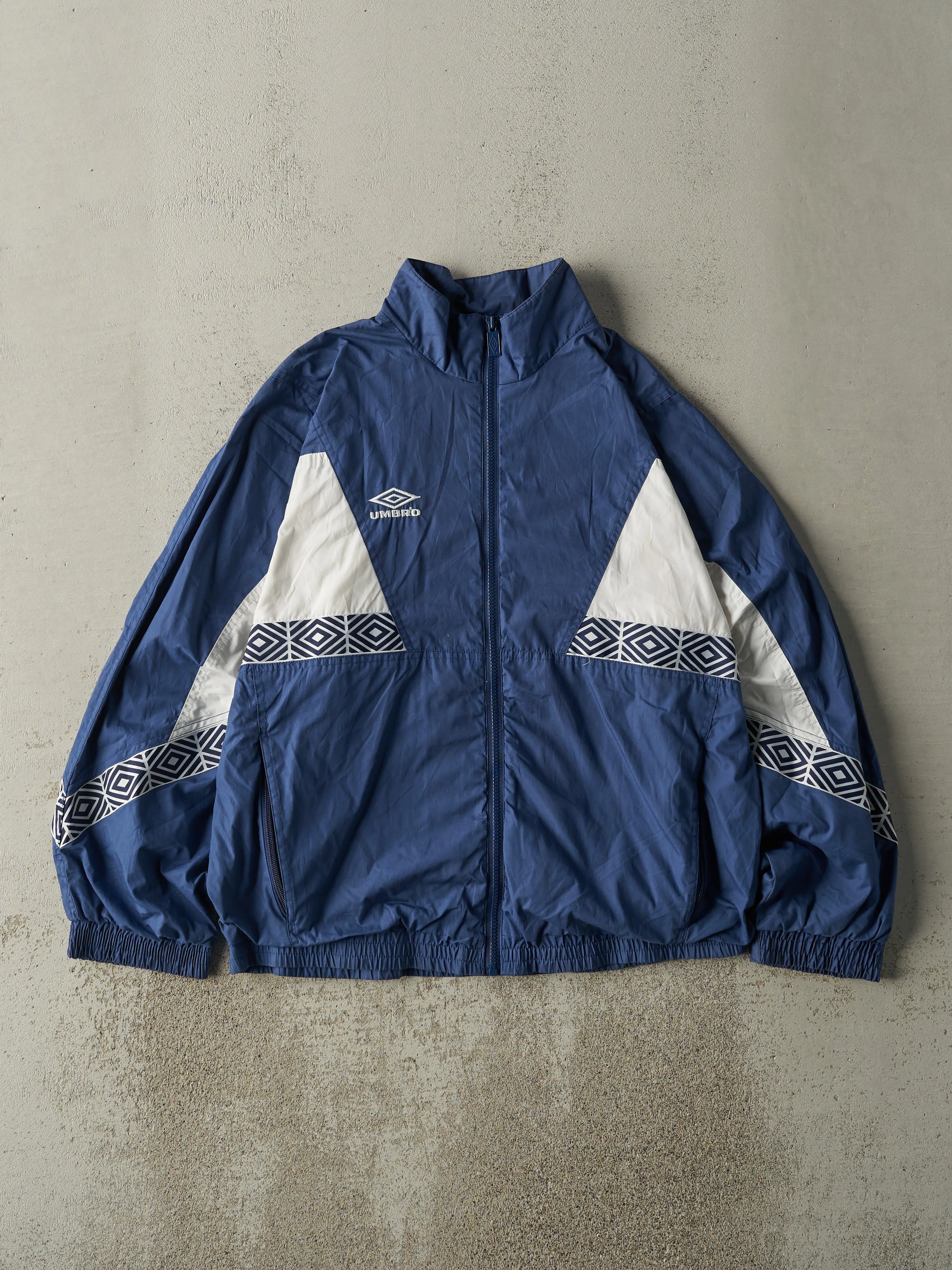 Vintage 90s Navy Blue & White Umbro Windbreaker Track Jacket (L) sold by Rebalance Vintage